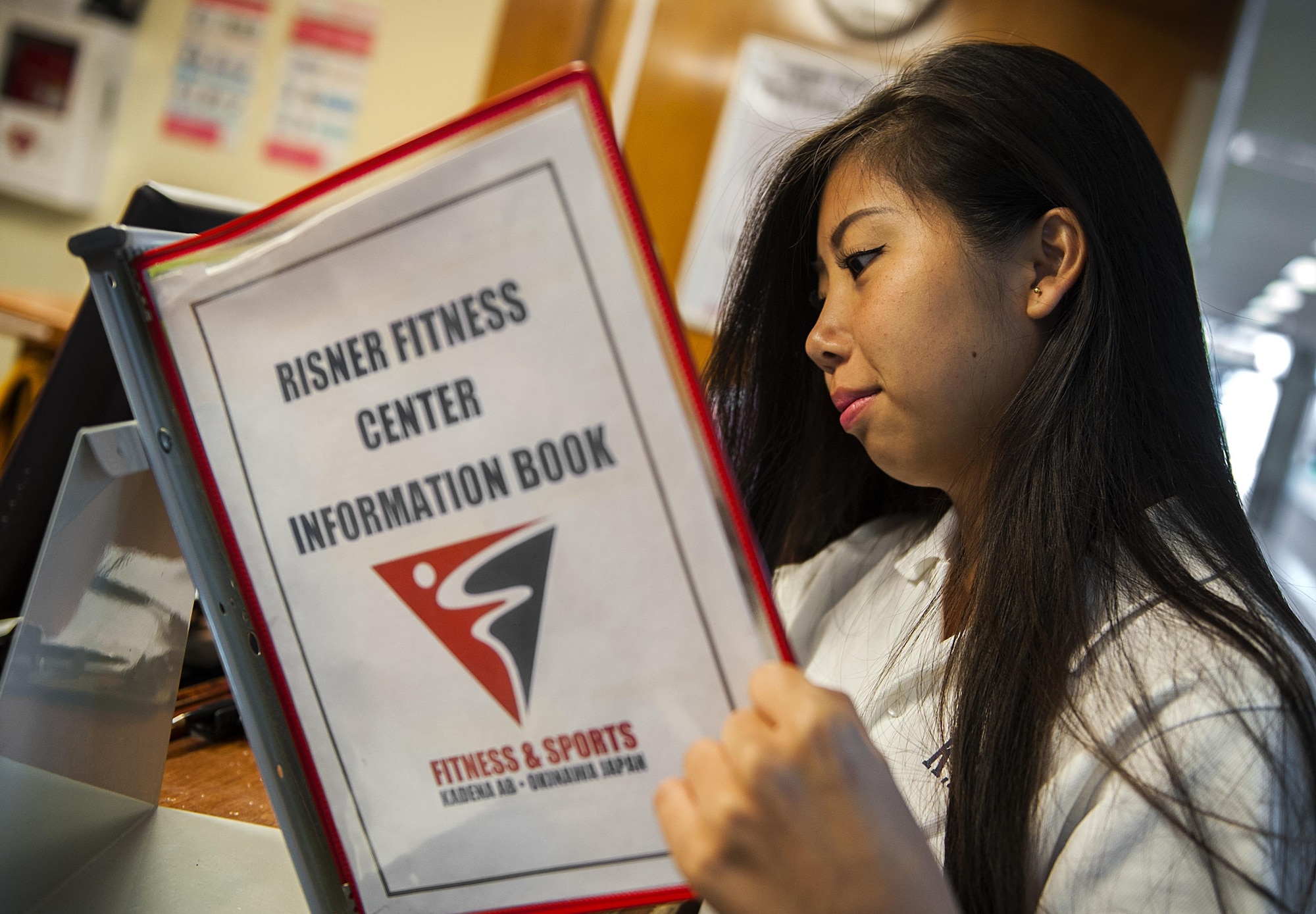 Yuka Kinjo, 18th Force Support Squadron intern, reads through the Risner information book Aug. 24, 2016, at Kadena Air Base, Japan. Each year, KLI students intern at various places on base to interact with English speakers better their skills. (U.S. Air Force photo by Airman 1st Class Corey M. Pettis)