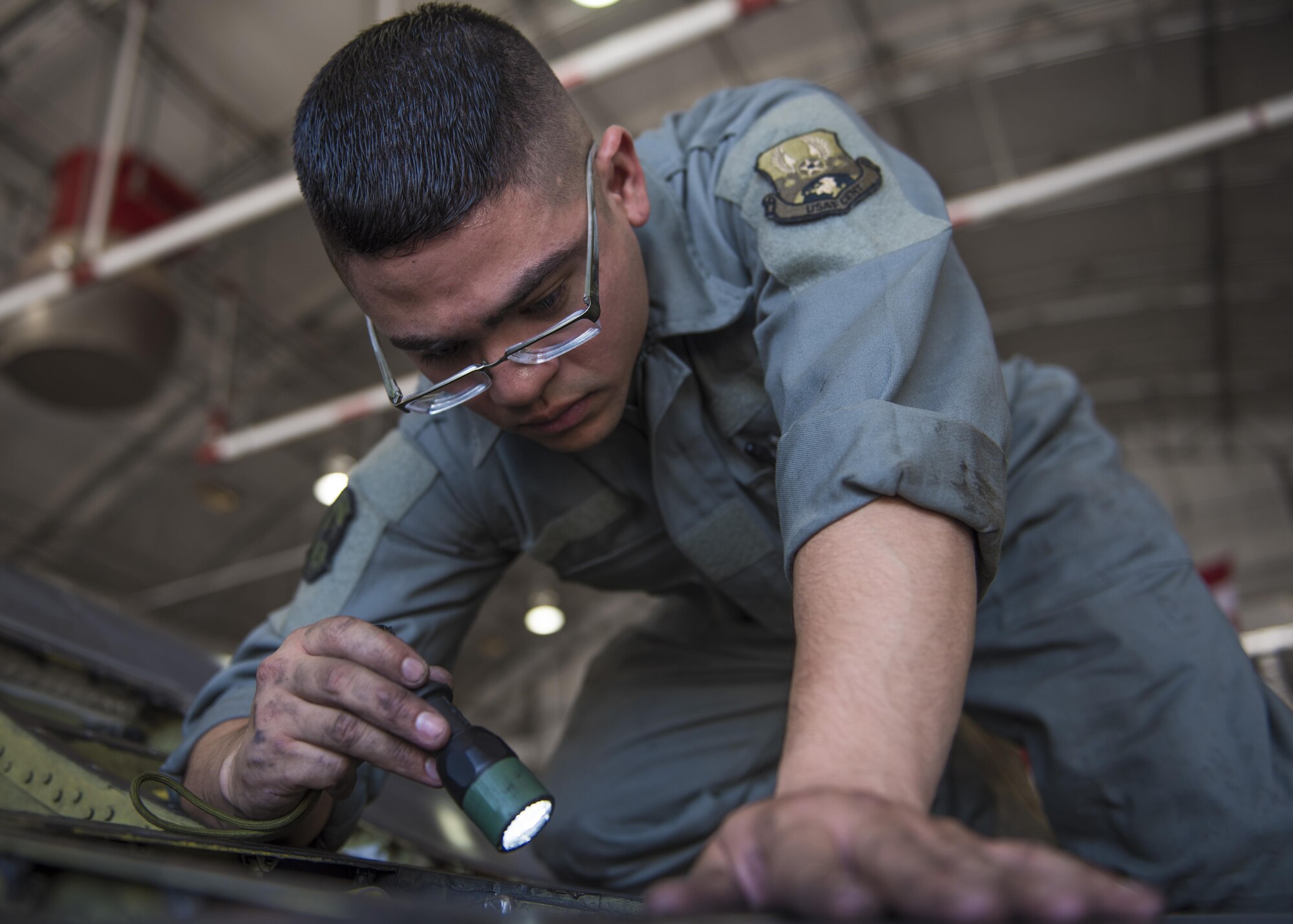 Staff Sgt. Juan Flores, 455th Expeditionary Maintenance Squadron electrical environment engineer, conducts a wire inspection on an F-16C Fighting Falcon, Bagram Airfield, Afghanistan, Aug. 22, 2016. During a 300 hour inspection, wires are checked for chafing, fire safety purposes, and to make sure major components are able to function properly. (U.S. Air Force photo by Senior Airman Justyn M. Freeman)