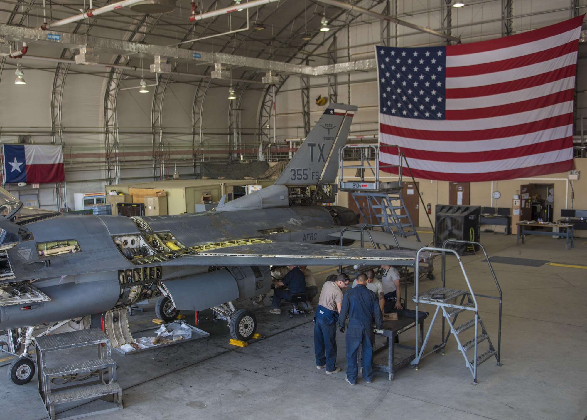 The 455th Expeditionary Maintenance Squadron Phase flight conducts a 300 hour inspection on an F-16C Fighting Falcon, Bagram Airfield, Afghanistan, Aug. 22, 2016. This aircraft is going through phase maintenance where members of the 455th EMXS phase flight closely inspect the aircraft for cracks and other types of damage, verifying that the 30 plus year old aircraft is safe to fly. (U.S. Air Force photo by Senior Airman Justyn M. Freeman)