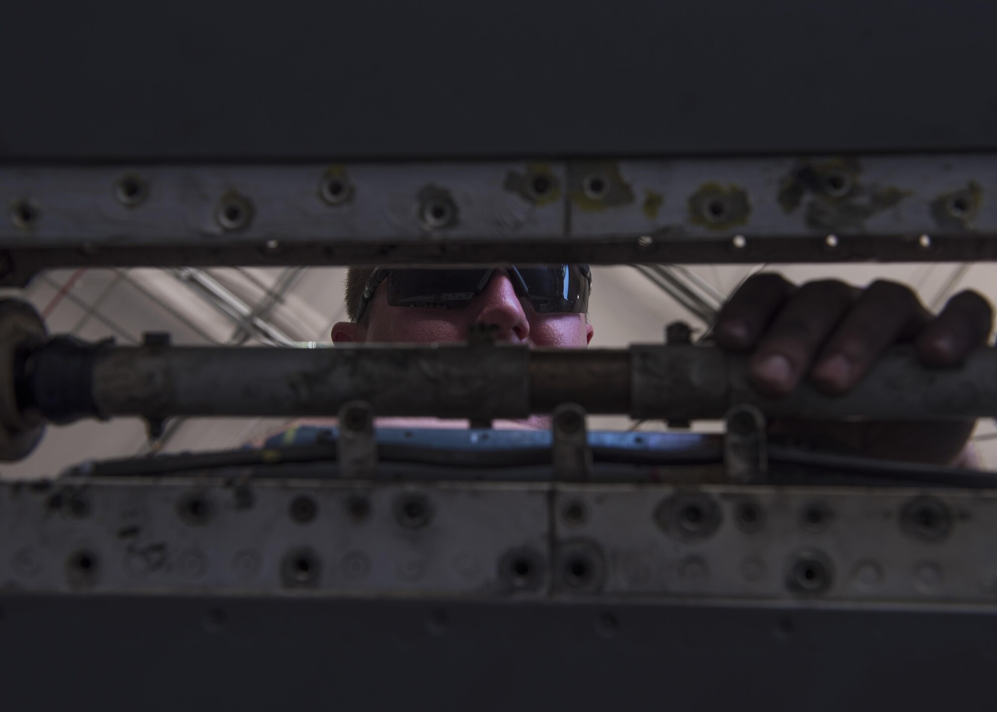 Staff Sgt. Ethan Van Dam, 455th Expeditionary Maintenance Squadron crew chief, installs counter pins for a torque shaft for an F-16C Fighting Falcon, Bagram Airfield, Afghanistan, Aug. 22, 2016. The torque shaft in the wing of the aircraft to help it achieve lift during takeoff. (U.S. Air Force photo by Senior Airman Justyn M. Freeman)