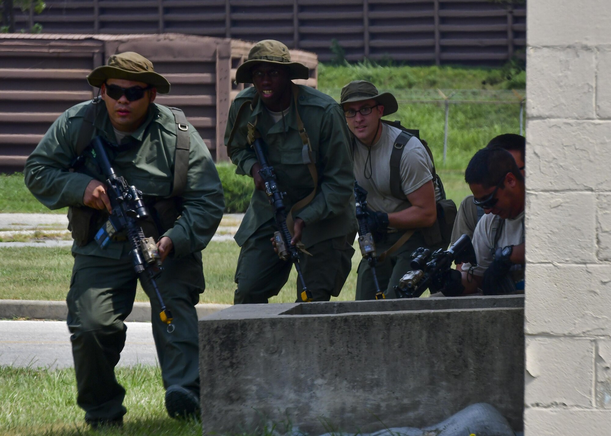 Team Osan opposition forces move into position during a simulated attack during Exercise Beverly Herd 16-2 at Osan Air Base, Republic of Korea, Aug. 25, 2016. The opposition forces simulate enemy movements and attacks, providing a realistic environment for 51st Security Forces Squadron Defenders to train in. (U.S. Air Force photo by Senior Airman Victor J. Caputo)