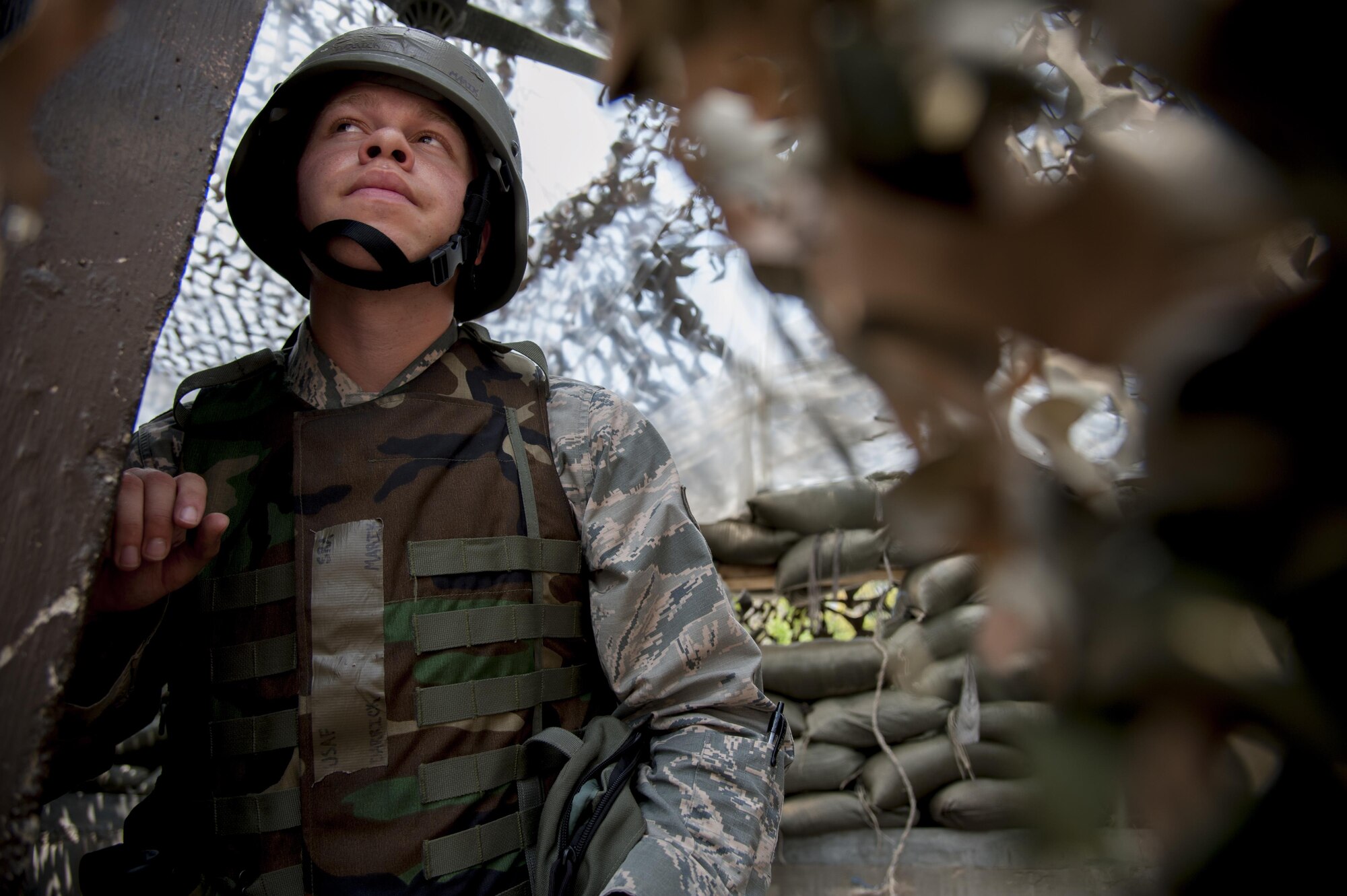 Senior Airman Darrick Marik, 51st Communications Squadron client systems technician, searches for opposing forces during a mock attack at Osan Air Base, Republic of Korea, Aug. 25, 2016. The mock attack was part of exercise Beverly Herd 16-2 and was designed test Osan’s ability to defend the base. (U.S. Air Force photo by Staff Sgt. Jonathan Steffen)