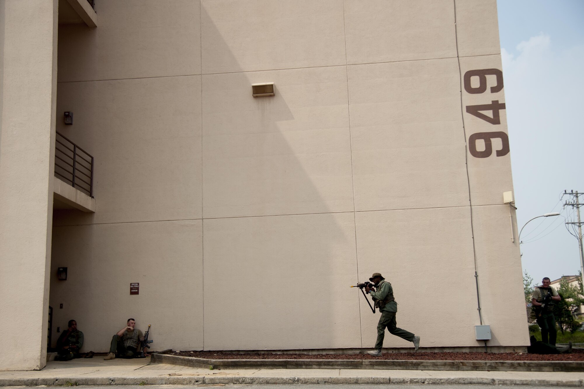 An opposing forces member advances their position while testing 51st Communications Squadron Airmen’s ability to defend their building at Osan Air Base, Republic of Korea, Aug. 25, 2016. The attack from opposing forces was a scenario during Exercise Beverly Herd 16-2 designed to test the 51st CS defensive capabilities. (U.S. Air Force photo by Staff Sgt. Jonathan Steffen)