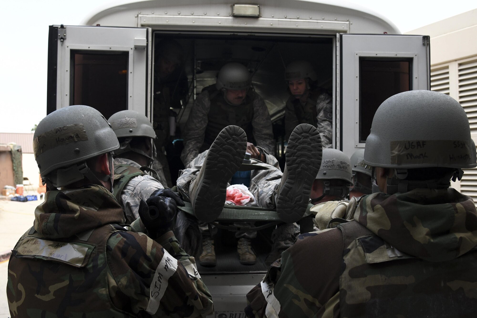 Medics from the 51st Medical Group load a mock patient onto a bus to be transported for aeromedical evacuation during Exercise Beverly Herd 16-2 on Osan Air Base, Republic of Korea, Aug. 24, 2016. The patients will simulate being loaded onto a C-130 Super Hercules to receive further treatment. (U.S. Air Force photo by Staff Sgt. Jonathan Steffen)