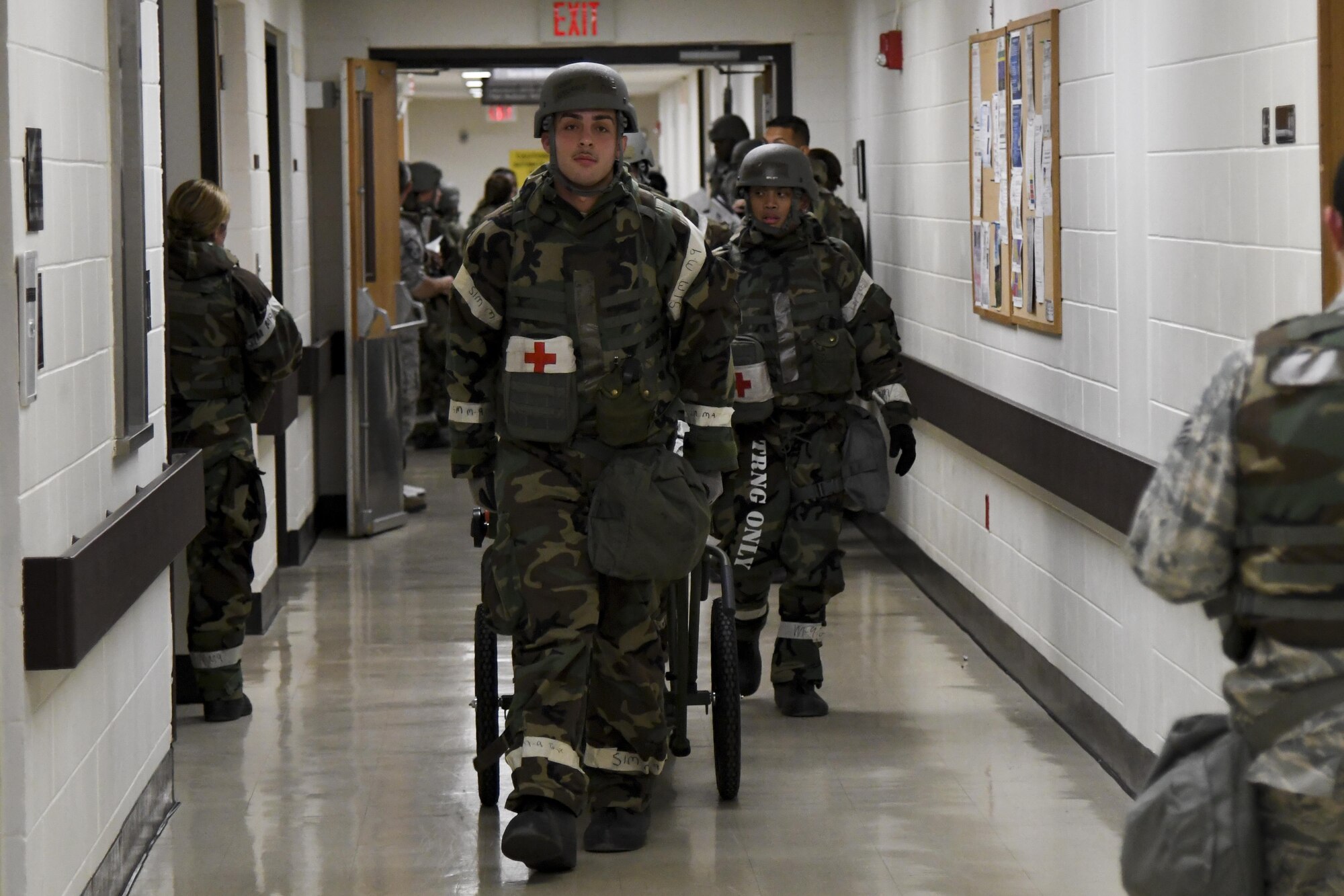 Medics from the 51st Medical Group transport mock patients on a stretcher prior to aeromedical evacuation during Exercise Beverly Herd 16-2 on Osan Air Base, Republic of Korea, Aug. 24, 2016. The aeromedical evacuation scenario allowed the 51st MDG to test their abilities to safely transport patients to an aircraft. (U.S. Air Force photo by Staff Sgt. Jonathan Steffen)