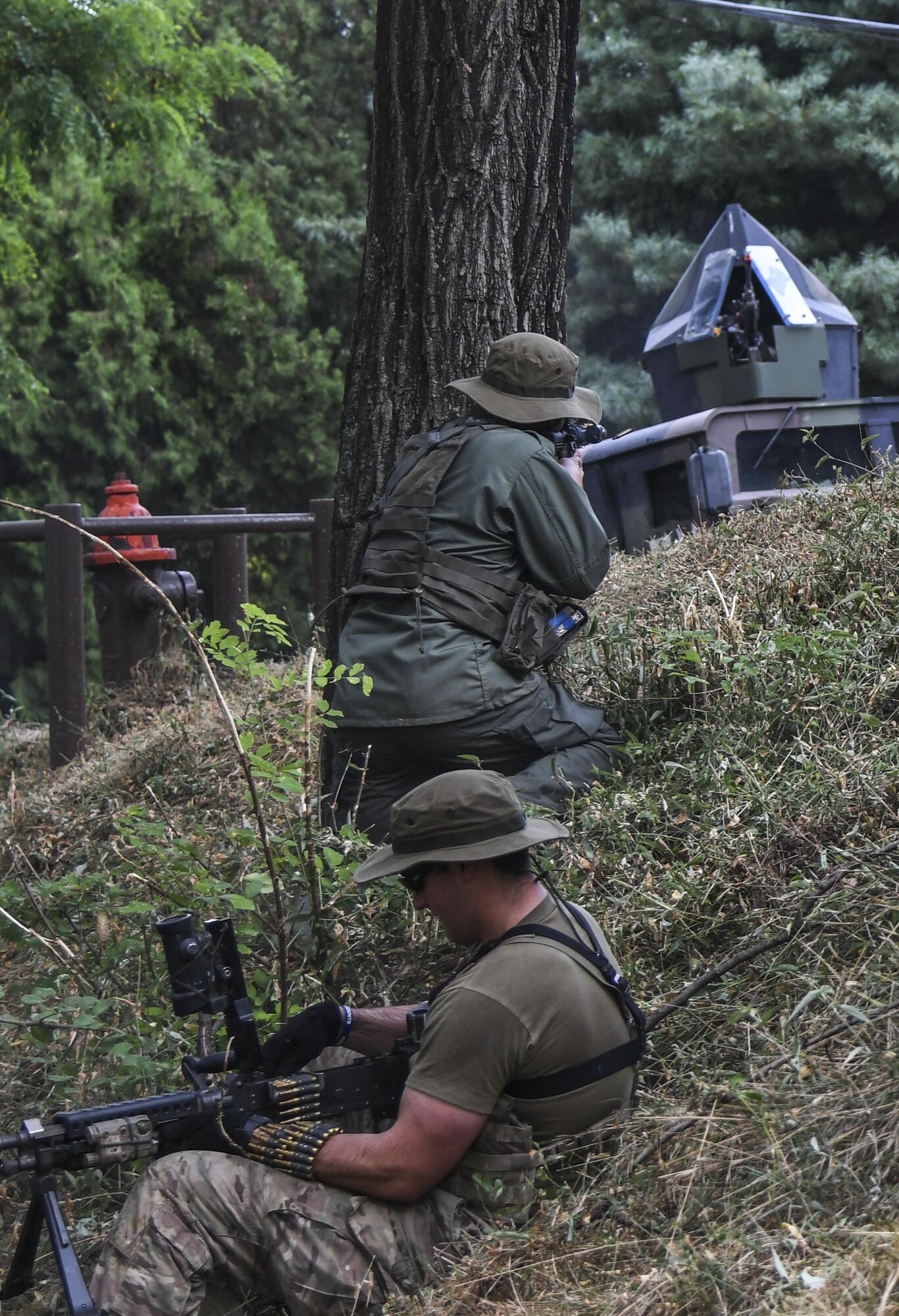 Soldiers from 1st Cavalry Division acting as Simulated opposing forces attack 51st Security Forces Squadron Defenders during an ambush scenario during Exercise Beverly Herd 16-2, on Osan Air Base, Republic of Korea, Aug. 24, 2016. Beverly Herd gives Team Osan the ability to practice wartime procedures in a realistic environment. (U.S. Air Force photo by Tech. Sgt. Rasheen Douglas)