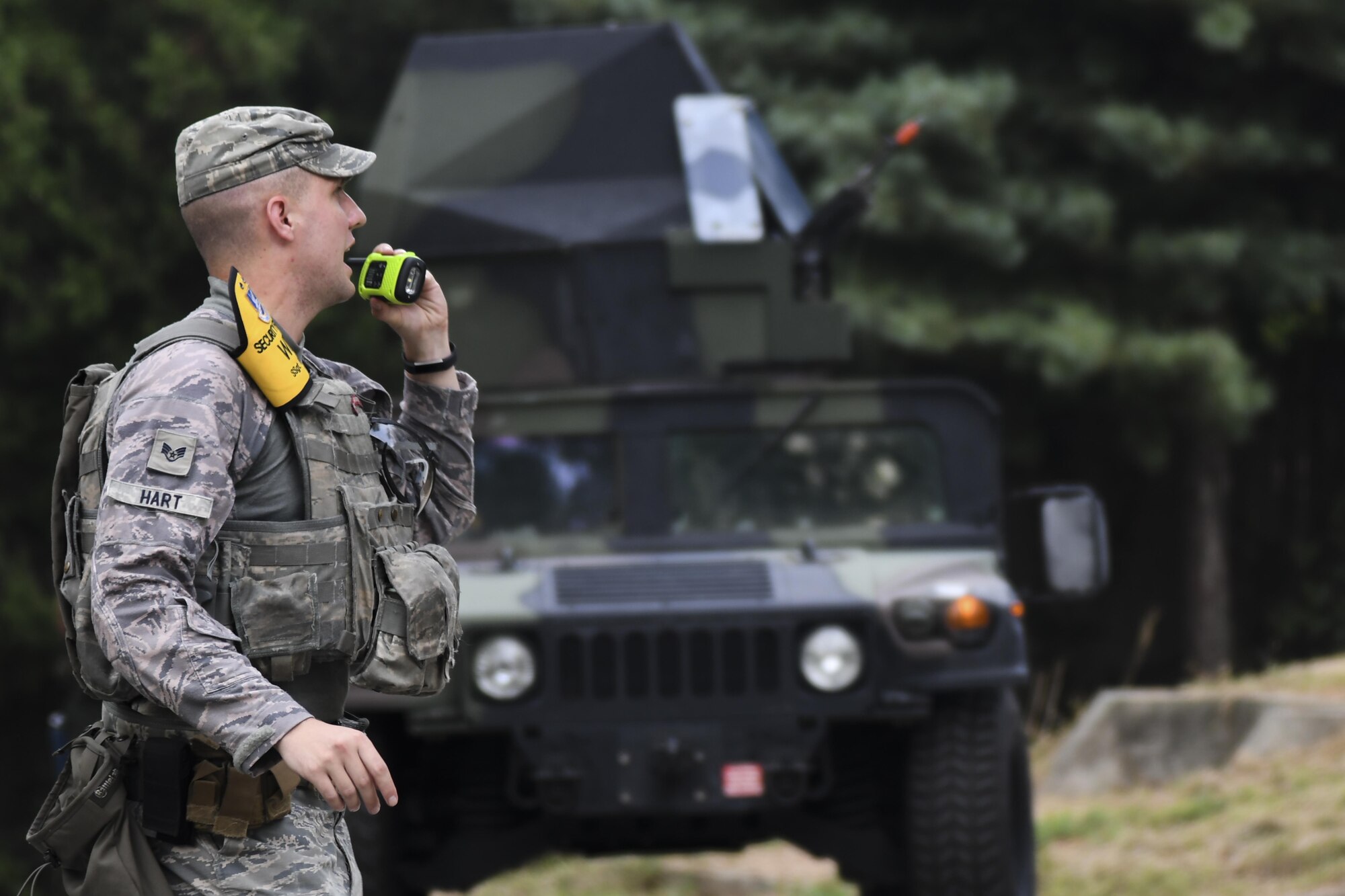 Staff Sgt. Kyle Hart, 51st Security Forces Squadron opposition forces coordinator, radios another OPFOR coordinator to prep opposing forces to attack as security forces in a Humvee approaches during Beverly Herd 16-2, on Osan Air Base, Republic of Korea, Aug. 24. The exercise provides U.S. armed for the opportunity to hone resourceful skills that can be used in the event of real-world contingencies. (U.S. Air Force photo by Tech. Sgt. Rasheen Douglas)