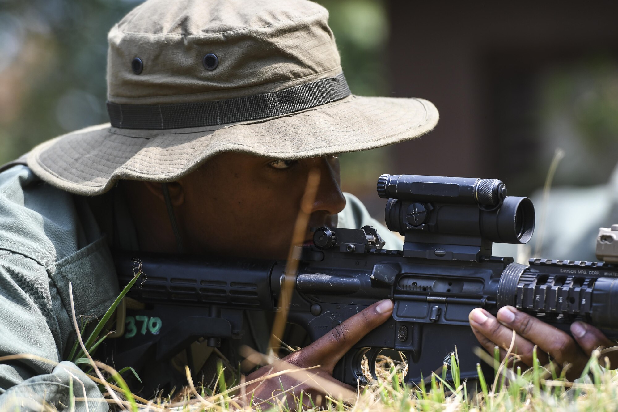 Simulated opposing forces member Airman 1st Class Jared Small stares down his sights while waiting for a truck with munitions to roll by during Exercise Beverly Herd 16-2, on Osan Air Base, Republic of Korea, Aug. 24, 2016. The OPFOR scenario was set up for U.S. armed forces to practice combat techniques. Beverly Herd provides U.S. armed for the opportunity to hone combat skills that can be used in the event of real-world contingencies. (U.S. Air Force photo by Tech. Sgt. Rasheen Douglas) 