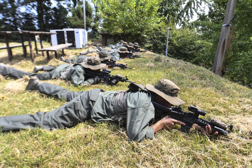 Simulated opposing forces begin to attack a U.S. convoy during a scenario where OPFOR attacks a truck carrying munitions during Exercise Beverly Herd 16-2, on Osan Air Base, Republic of Korea, Aug. 24, 2016. Beverly Herd gives security forces and other units an opportunity to practice tactics they need to apply to real-world situations. (U.S. Air Force photo by Tech. Sgt. Rasheen Douglas)