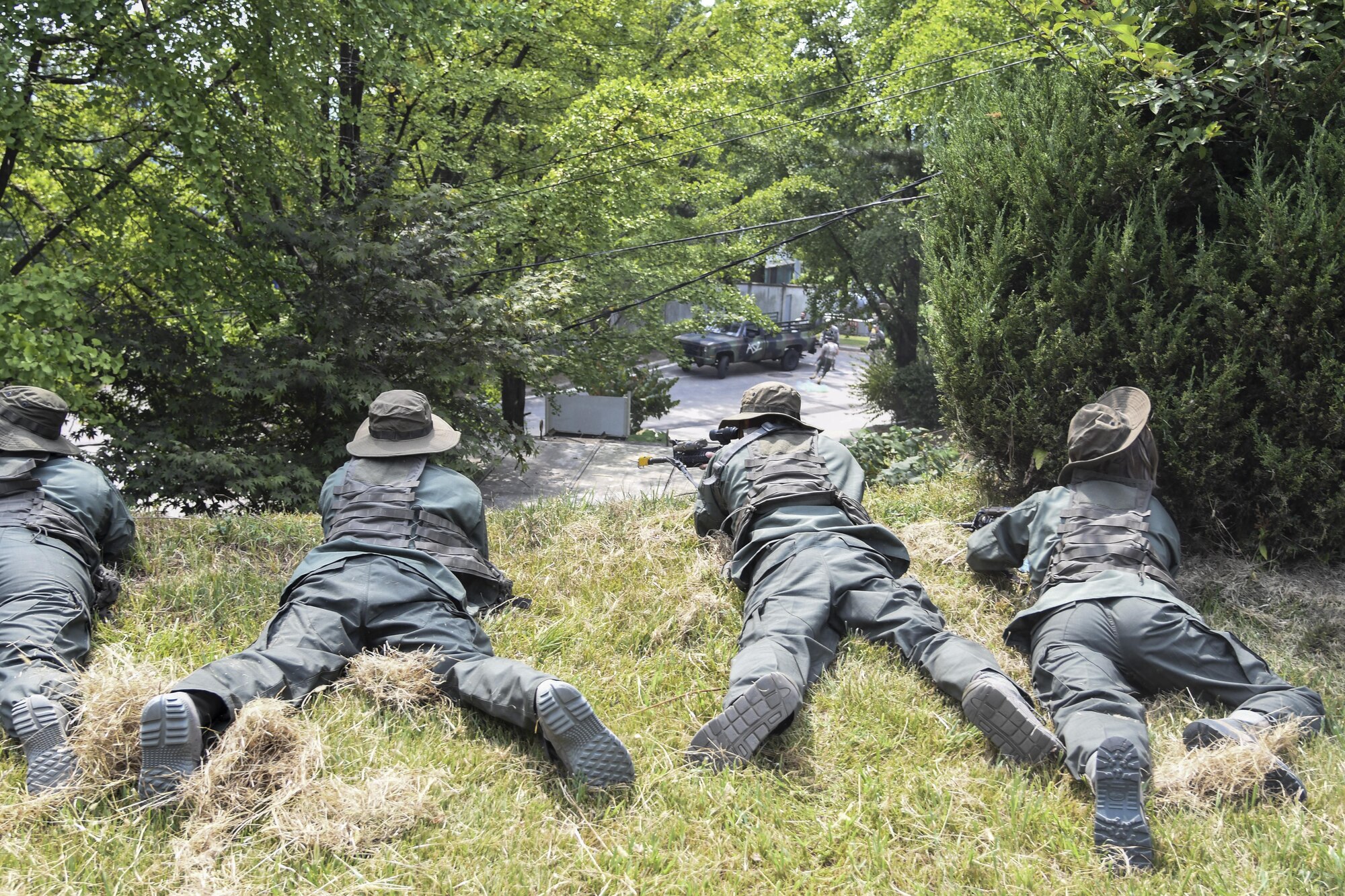Simulated opposing forces get into attack position during an ambush scenario on a munitions supply truck Exercise Beverly Herd 16-2, on Osan Air Base, Republic of Korea, Aug. 24, 2016. Beverly Herd 16-2 provides U.S. armed forces the chance to hone practical skills that can be used in the event of real-world contingencies. (U.S. Air Force photo by Tech. Sgt. Rasheen Douglas)