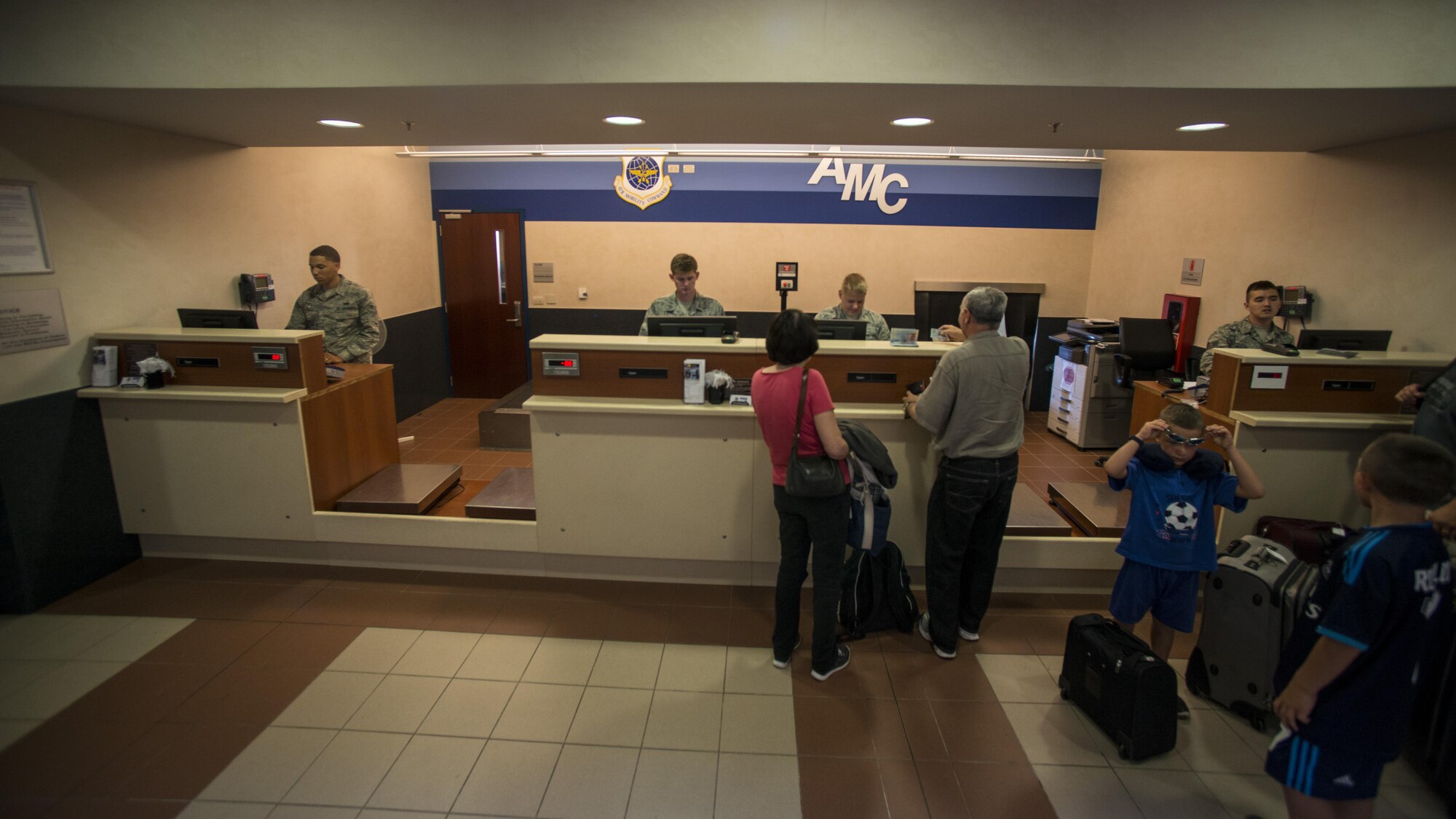 Airmen of the 724th Air Mobility Squadron check-in passengers Aug. 24, 2016, at Aviano Air Base, Italy. Approximate 1,300 individuals are processed through the Aviano terminal each month. (U.S. Air Force photo by Senior Airman Krystal Ardrey/Released)