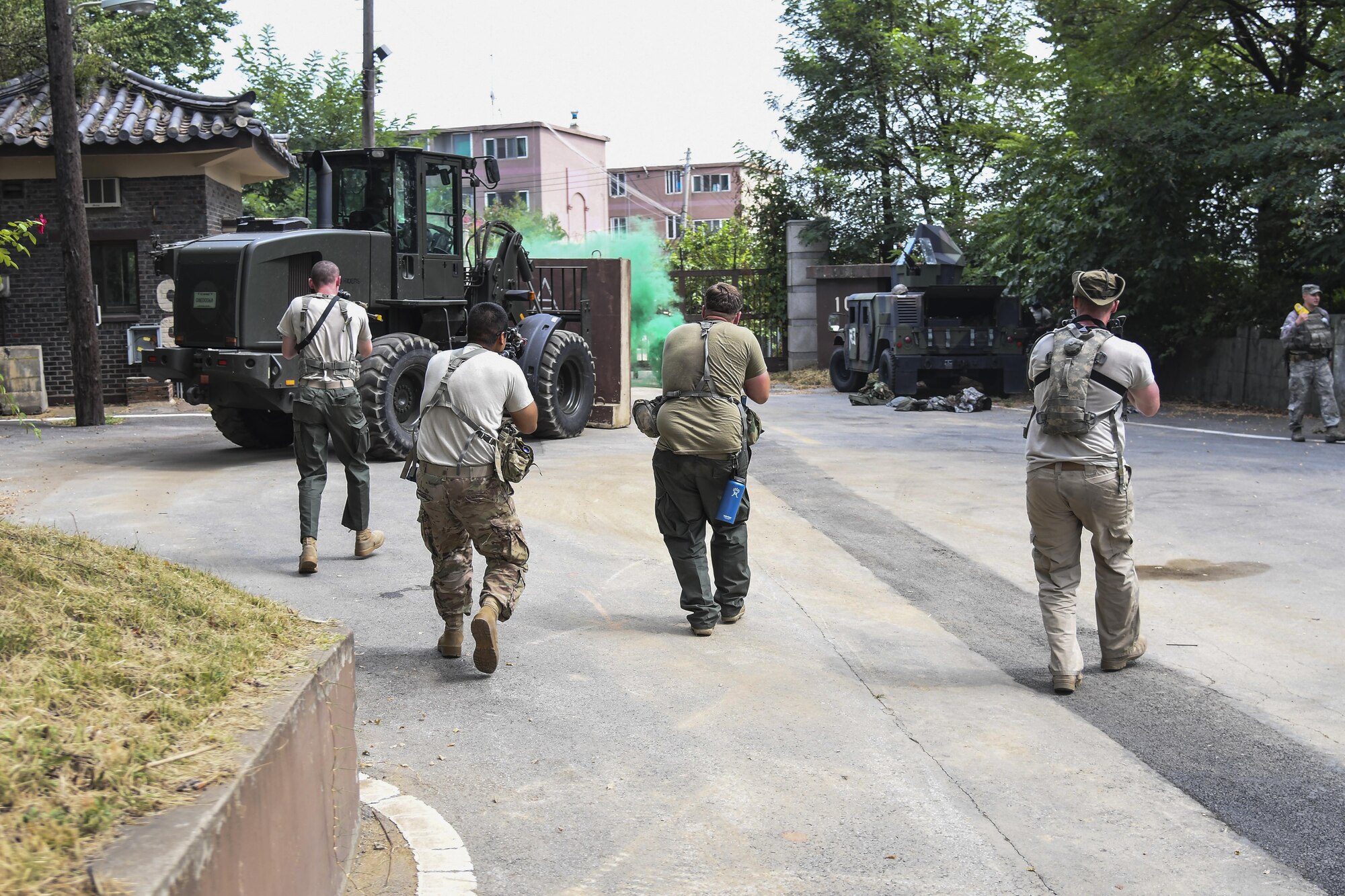 Soldiers from the 1st Cavalry Division acting as simulated opposing forces closing in on 51st Security Forces Squadron members during Exercise Beverly Herd 16-2, on Osan Air Base, Republic of Korea, Aug. 24, 2016. Exercises like Beverly Herd gives Team Osan the chance to showcase the 51st Fighter Wing’s ability to “Fight Tonight.” (U.S. Air Force photo by Tech. Sgt. Rasheen Douglas)