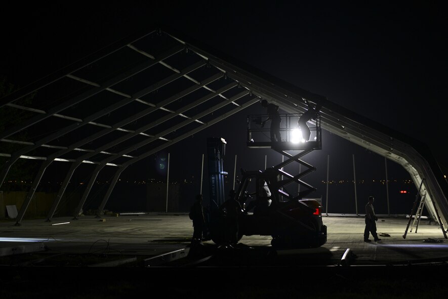 U.S. Air Force Airmen from the 49th Materiel Maintenance Squadron from Holloman Air Force Base, N.M., build an 8K dome shelter Aug. 8, 2016, at Incirlik Air Base, Turkey. The team is from the only active-duty squadron in the U.S. Air Force that specializes in Basic Expeditionary Airfield Resources and construction of large shelters. (U.S. Air Force photo by Tech. Sgt. Caleb Pierce)