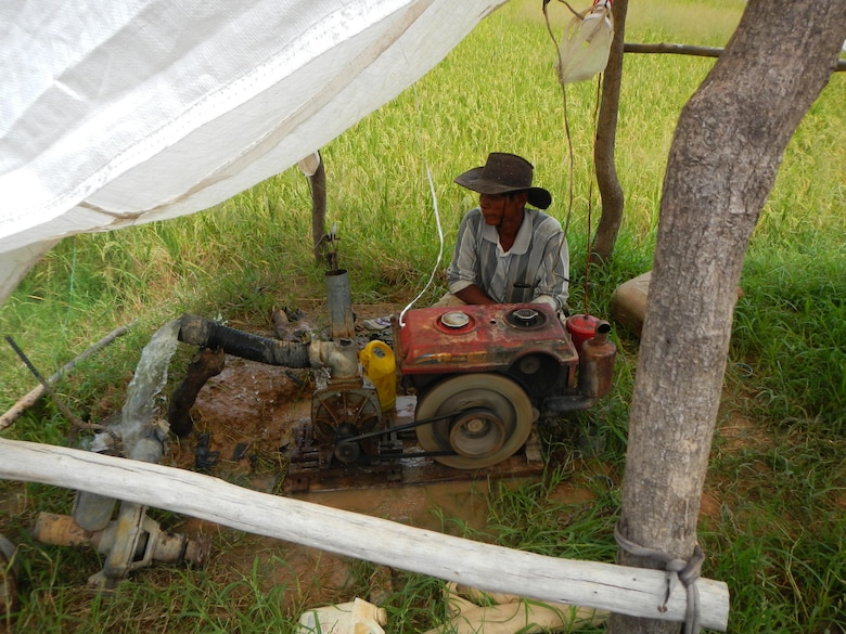 A rice farmer demonstrates use of a typical irrigation well in Cambodia. The U.S. Army Corps of Engineers led a three-day groundwater modeling workshop for Cambodian government officials, representatives from the U.S. Agency for International Development, and local non-governmental organizations from Aug. 9-11. 