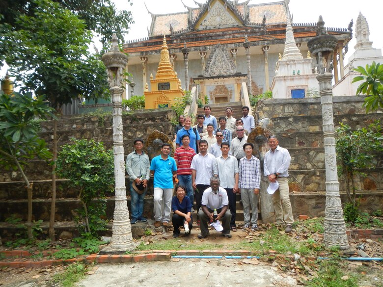 Participants and instructors posed for a photo in front of a Buddhist temple in the Kampong Cham Province during a groundwater modeling workshop in Cambodia Aug 9-11. The workshop was designed to provide an overview of groundwater principles and modeling tools that can help engineers, planners, and water resources managers make more informed decisions