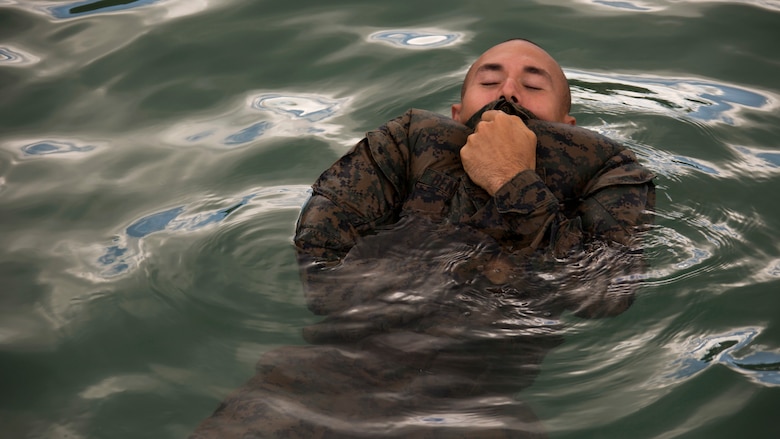 Cpl. Joseph J. Bennetti, a machine gunner, uses his blouse to float during a French Armed Forces Nautical Commando Course off the coast of Noumea, New Caledonia, August 15, 2016. The course is a part of Exercise AmeriCal 16, a bilateral training exercise designed to enhance mutual combat capabilities and improve relations with our partners by exchanging a U.S. Marine Corps and French Armed Forces infantry platoon. While the U.S. Marines are in New Caledonia, the French infantry platoon traveled to Australia to participate in Exercise Koolendong 16 with U.S. and Australian forces. Bennetti, from New York, New York, are with Marine Rotational Force – Darwin. 