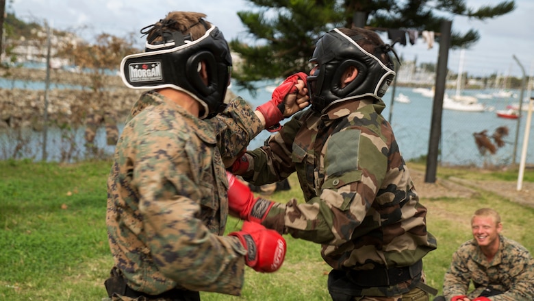 A Marine with Marine Rotational Force – Darwin and a French Army soldier with 92nd Infantry Regiment box during a French Armed Forces Nautical Commando Course at Quartier Gribeauval, New Caledonia, August 16, 2016. The course is a part of Exercise AmeriCal 16, a bilateral training exercise designed to enhance mutual combat capabilities and improve relations with our partners by exchanging a U.S. Marine Corps and French Armed Forces infantry platoon. While the U.S. Marines are in New Caledonia, the French infantry platoon traveled to Australia to participate in Exercise Koolendong 16 with U.S. and Australian forces. 