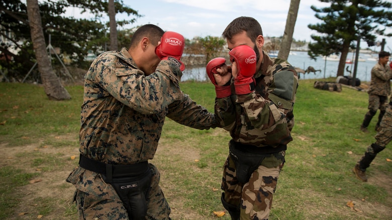 Sgt. Ryan R. Krohn, left, a rifleman, and French Army Sgt. Axel Fauss, an infantryman, box during a French Armed Forces Nautical Commando Course at Quartier Gribeauval, New Caledonia, August 16, 2016. The course is a part of Exercise AmeriCal 16, a bilateral training exercise designed to enhance mutual combat capabilities and improve relations with our partners by exchanging a U.S. Marine Corps and French Armed Forces infantry platoon. While the U.S. Marines are in New Caledonia, the French infantry platoon traveled to Australia to participate in Exercise Koolendong 16 with U.S. and Australian forces. Krohn, from Acworth, Georgia, is with Marine Rotational Force – Darwin. Fauss, from French Alps, France, is with 92nd Regiment, French Army. 