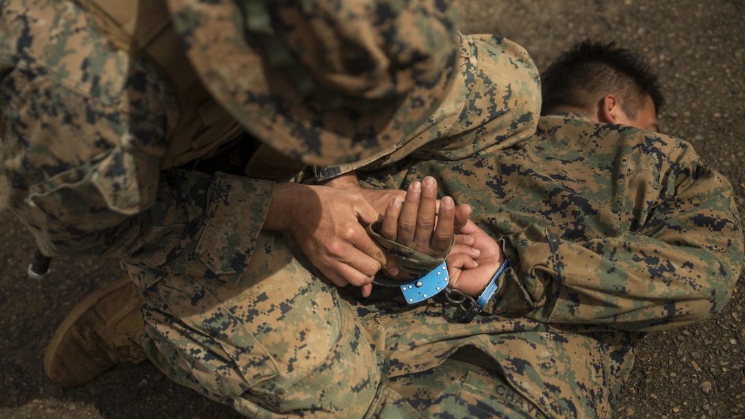 Marines with Marine Rotational Force – Darwin practice capturing enemy personnel during a French Armed Forces Nautical Commando Course at Quartier Gribeauval, New Caledonia, August 18, 2016. The course is a part of Exercise AmeriCal 16, a bilateral training exercise designed to enhance mutual combat capabilities and improve relations with our partners by exchanging a U.S. Marine Corps and French Armed Forces infantry platoon. While the U.S. Marines are in New Caledonia, the French infantry platoon traveled to Australia to participate in Exercise Koolendong 16 with U.S. and Australian forces. 