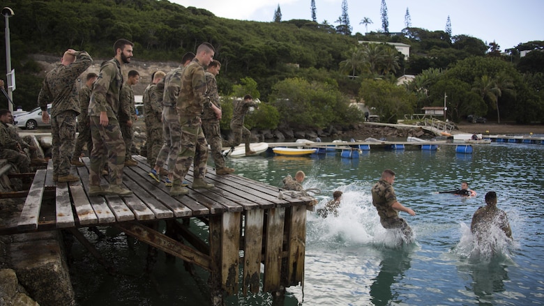 U.S. Marines with Marine Rotational Force – Darwin and French Armed Forces soldiers with 92nd Infantry Regiment, French Army, jump into the ocean during a French Armed Forces Nautical Commando Course off the coast of Noumea, New Caledonia, August 15, 2016. The course is a part of Exercise AmeriCal 16, a bilateral training exercise designed to enhance mutual combat capabilities and improve relations with our partners by exchanging a U.S. Marine Corps and French Armed Forces infantry platoon. While the U.S. Marines are in New Caledonia, the French infantry platoon traveled to Australia to participate in Exercise Koolendong 16 with U.S. and Australian forces. 