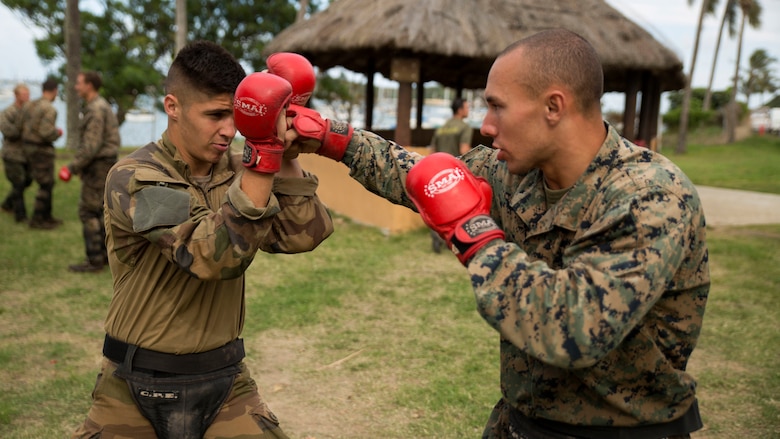 French Army Pfc. Quentin Antomarchi, left, an infantryman, and Cpl. Joseph J. Bennetti, a machine gunner, box during a French Armed Forces Nautical Commando Course at Quartier Gribeauval, New Caledonia, August 16, 2016. The course is a part of Exercise AmeriCal 16, a bilateral training exercise designed to enhance mutual combat capabilities and improve relations with our partners by exchanging a U.S. Marine Corps and French Armed Forces infantry platoon. While the U.S. Marines are in New Caledonia, the French infantry platoon traveled to Australia to participate in Exercise Koolendong 16 with U.S. and Australian forces. Antomarchi from Toulouse, France, is with 92nd Infantry Regiment, French Army. Bennetti, from New York, New York, is with Marine Rotational Force – Darwin. 