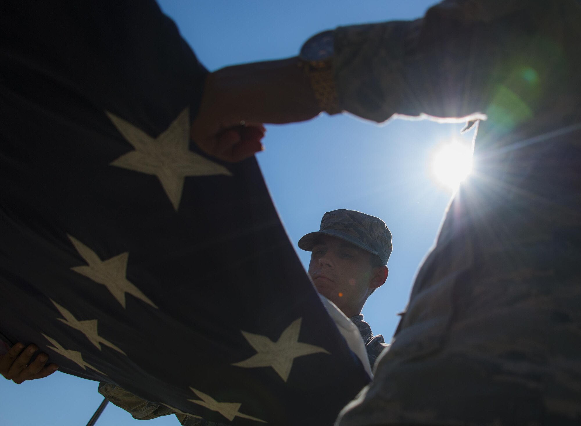 Staff Sgt. James Pratte, 96th Logistics Readiness Squadron, completes another fold of the American Flag during a practice session Aug. 24 prior to his unit’s retreat ceremony the following day at Eglin Air Force Base, Fla.  Team Eglin hosts a reveille and retreat ceremony performed by a different base unit each month.  The 96th Test Wing’s command staff Airmen teach unit volunteers the proper procedures at practice sessions before the event usually held on the last Thursday of the month.  (U.S. Air Force photo/Samuel King Jr.)