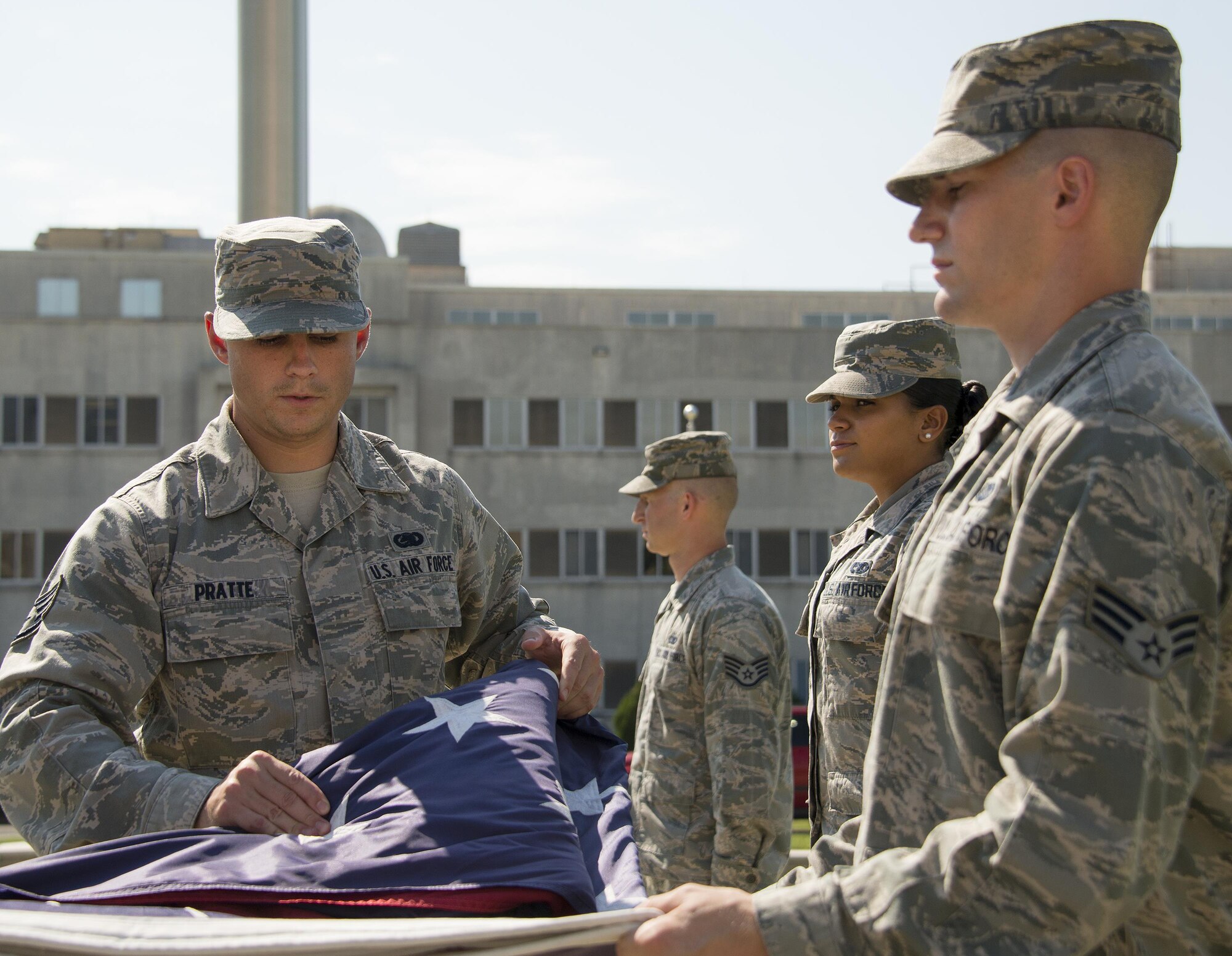 Staff Sgt. James Pratte, 96th Logistics Readiness Squadron, completes another fold of the American Flag during a practice session Aug. 24 prior to his unit’s retreat ceremony the following day at Eglin Air Force Base, Fla.  Team Eglin hosts a reveille and retreat ceremony performed by a different base unit each month.  The 96th Test Wing’s command staff Airmen teach unit volunteers the proper procedures at practice sessions before the event usually held on the last Thursday of the month.  (U.S. Air Force photo/Samuel King Jr.)