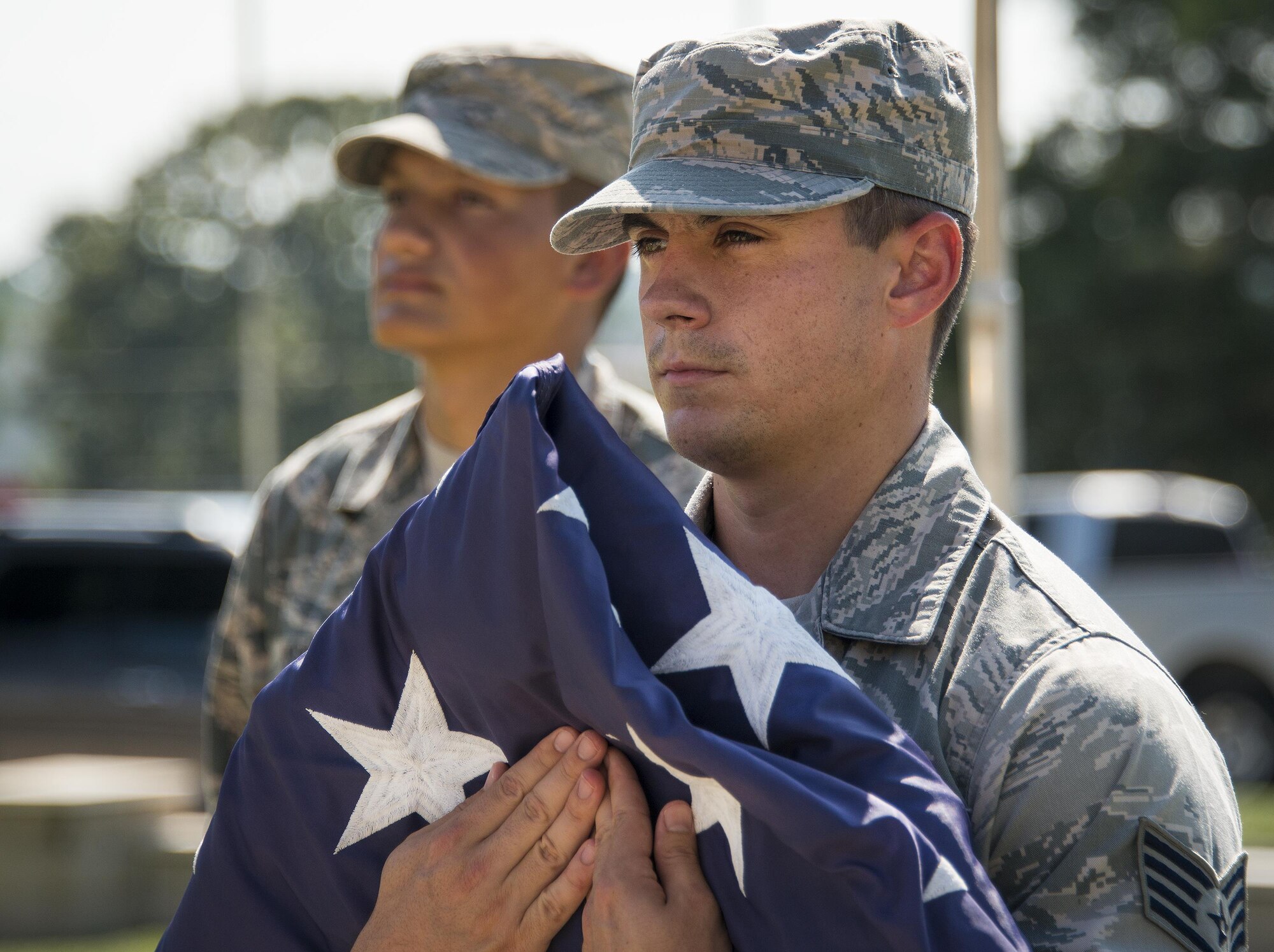 Staff Sgt. James Pratte, 96th Logistics Readiness Squadron, prepares to retire the flag during a practice session Aug. 24 prior to his unit’s retreat ceremony the following day at Eglin Air Force Base, Fla.  Team Eglin hosts a reveille and retreat ceremony performed by a different base unit each month.  The 96th Test Wing’s command staff Airmen teach unit volunteers the proper procedures at practice sessions before the event usually held on the last Thursday of the month.  (U.S. Air Force photo/Samuel King Jr.)