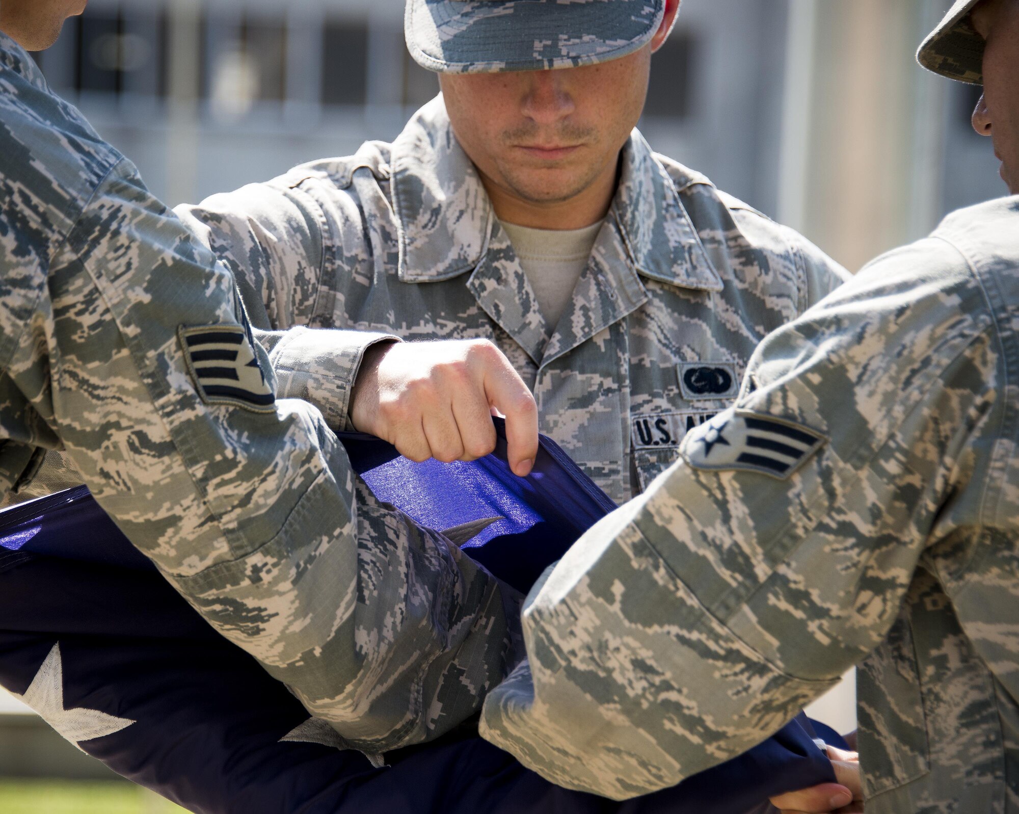 Staff Sgt. James Pratte, 96th Logistics Readiness Squadron, completes the folding of the American Flag during a practice session Aug. 24 prior to his unit’s retreat ceremony the following day at Eglin Air Force Base, Fla.  Team Eglin hosts a reveille and retreat ceremony performed by a different base unit each month.  The 96th Test Wing’s command staff Airmen teach unit volunteers the proper procedures at practice sessions before the event usually held on the last Thursday of the month.  (U.S. Air Force photo/Samuel King Jr.)