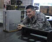 Airman 1st Class Sterling Crutcher, 2nd Munitions Squadron Production Flight conventional maintenance crew member, puts finishing touches on an eight flare sticks module at Barksdale Air Force Base, La., August 18, 2016. Crutcher and his team were tasked to build 96 modules of flares. (U.S. Air Force photo/Airman 1st Class Stuart Bright)