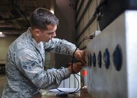 Airman 1st Class Jared Keith, 2nd Munitions Squadron Production Flight conventional maintenance crew member, uses a 620A Igniter Tester to test a row of flare modules at Barksdale Air Force Base, La., August 18, 2016. When being tested, a module will have a shortening ring on it, which prevents accidental ignition. (U.S. Air Force photo/Airman 1st Class Stuart Bright)