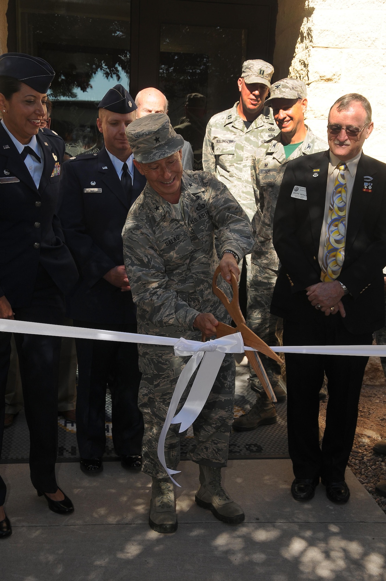 Brig. Gen. Andrew Salas, New Mexico National Guard adjutant general, cuts the ribbon during the dedication of the 250th Intelligence Squadron building Aug. 19. The $5 million state-of-the-art facility features secure workspaces and training areas. (U.S. National Guard photo by Master Sgt. Paula Aragon)
