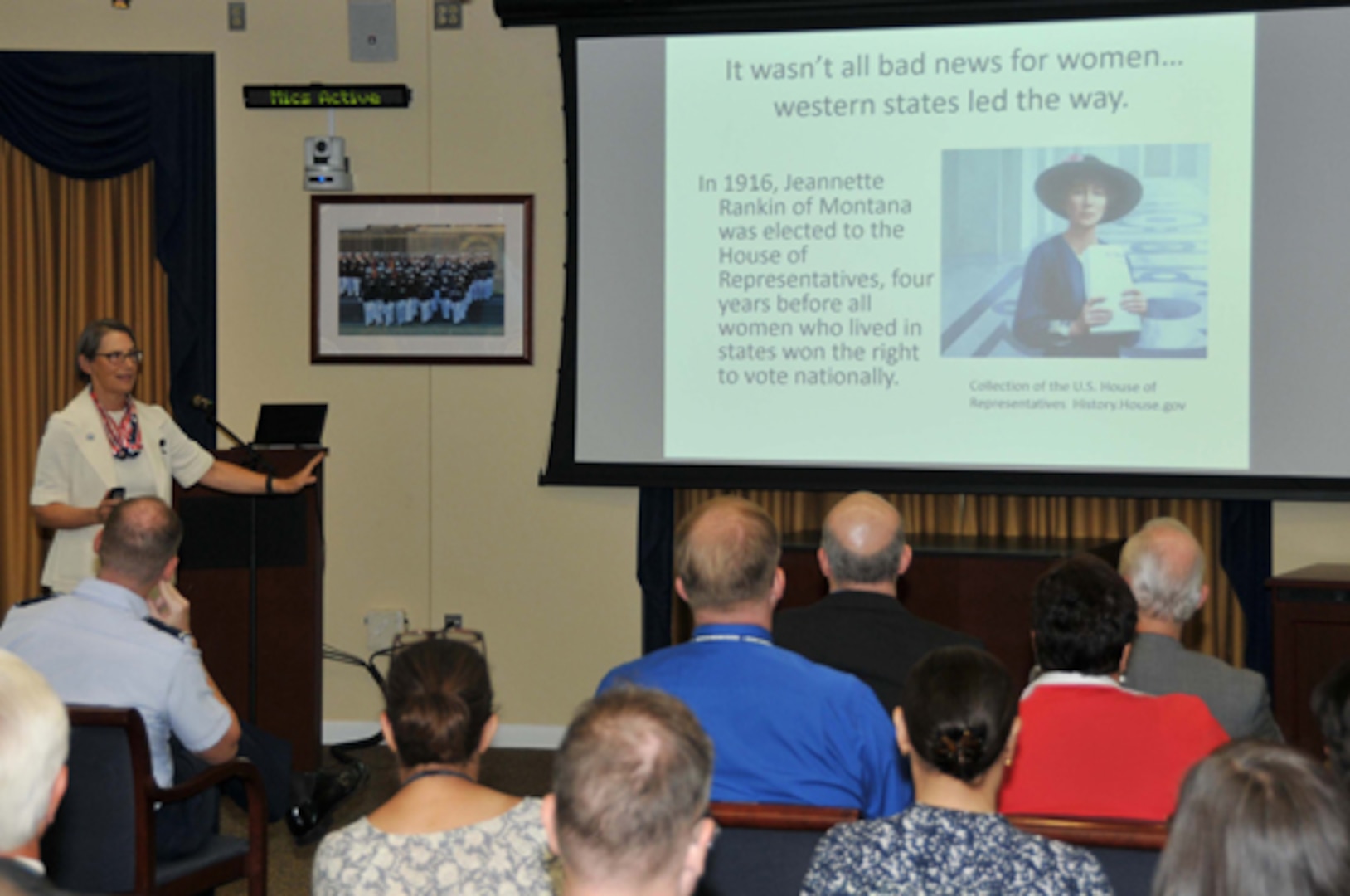 The Women's Equality Day event guest speaker, Kathryn Ray, former president of The League of Women Voters of the District of Columbia and currently a reference librarian at American University in Washington, D.C., speaks to Defense Logistics Agency employees about women's struggles and triumphs to gain the right to vote during a Women’s Equality Day event held at the McNamara Headquarters Complex, Fort Belvoir, Virginia, Aug. 24. 