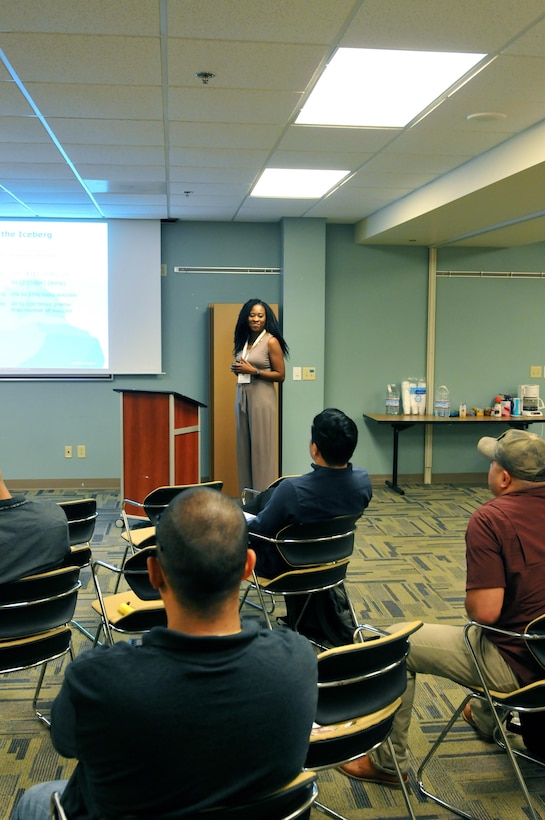 Renita Duncan, an Applied Suicide Intervention Skills Training (ASIST) trainer for the 63rd Regional Support Command, smiles while engaging in conversation during ASIST, Aug. 23, Armed Forces Reserve Center, Mountain View, Calif. The two-day course, which uses a prescribed curriculum from Living Works Education, focuses primarily on intervention and how to safely assist those suffering from suicidal thoughts.