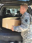 Texas Army National Guard Cadet David Williams, 149th Attack-Reconnaissance Battalion, and a current resident of Baton Rouge in Houston collected supplies to bring to Louisiana Guardsmen who lost their homes to the recent flooding in Baton Rouge, August 21, 2016. Texas Guardsmen from the unit collected more than 20 bags of clothes, appliances, tools, diapers, baby formula and food for the victims of the natural disaster and transported them more than 250 miles for the guardsmen and their families. 