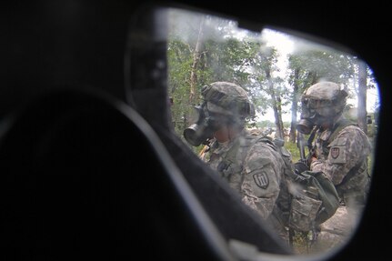 U.S. Army Reserve Soldiers assigned to the 327th Engineer Company, 397th Engineer Battalion, 372nd Engineer Brigade, 416th Theater Support Command, donned their pro masks in a complex attack that included "chemical" warfare during Combat Support Training Exercise 86-16-03 (CSTX 86-16-03) on Fort McCoy, Wis., Aug. 22, 2016. Nearly 9,000 service members from across the country are participating in CSTX 86-16-03 hosted by the 86th Training Division and the 84th Training Command’s third and final CSTX of the year. (U.S. Army Reserve Photo by Sgt. 1st Class Clinton Wood).