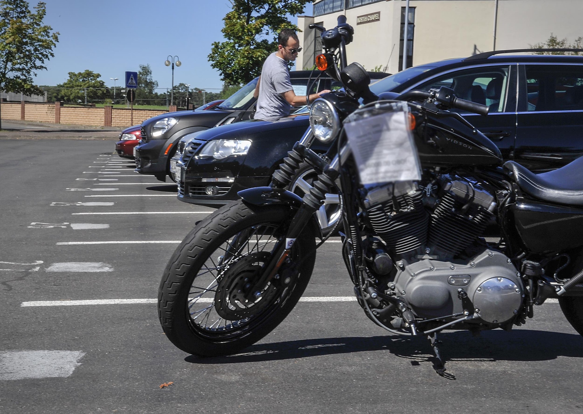 A customer looks at vehicle prices at the 86th Force Support Squadron Outdoor Recreation resale lot Aug. 24, 2016, at Ramstein Air Base, Germany. The resale lot offers incoming and outgoing Kaiserslautern Military Community members the option to buy and sell vehicles to make their transitions a little smoother. (U.S. Air Force photo/Senior Airman Larissa Greatwood)