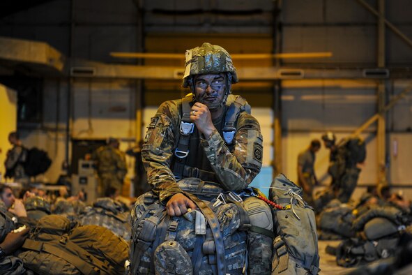 Army Spc. Brady Spillane, an 82nd Airborne Division forward observer, prepares for a static-line jump in support of exercise Green Flag Little Rock 16-09 on Aug. 18, 2016, near Fort Polk, La. Spillane was one of about 750 paratroopers to jump from Air Mobility Command aircraft during the exercise. (U.S. Air Force photo/Airman Kevin Sommer Giron)