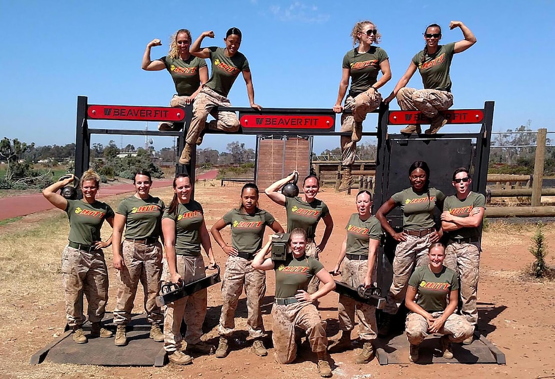 2nd Lt. Delaney T. Bourlakov (center kneeling) adjutant, Marine Corps Logistics Base Albany, poses with some of the female competitors at the second annual High Intensity Tactical Training Athlete Championship aboard Marine Corps Air Station Miramar in San Diego, California, Aug. 17.