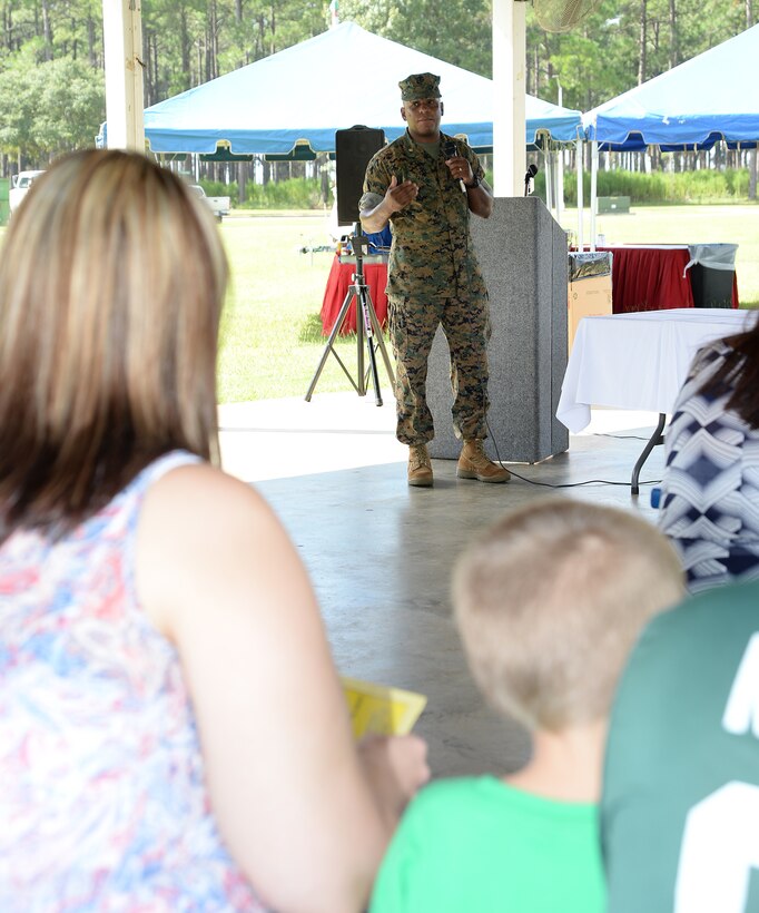 Major Lee Taylor, retired, keynote speaker, explains how reading and winning go hand-in-hand during Marine Corps Logistics Base Albany’s Summer Reading Awards Program at Covella Pond, Aug. 20.