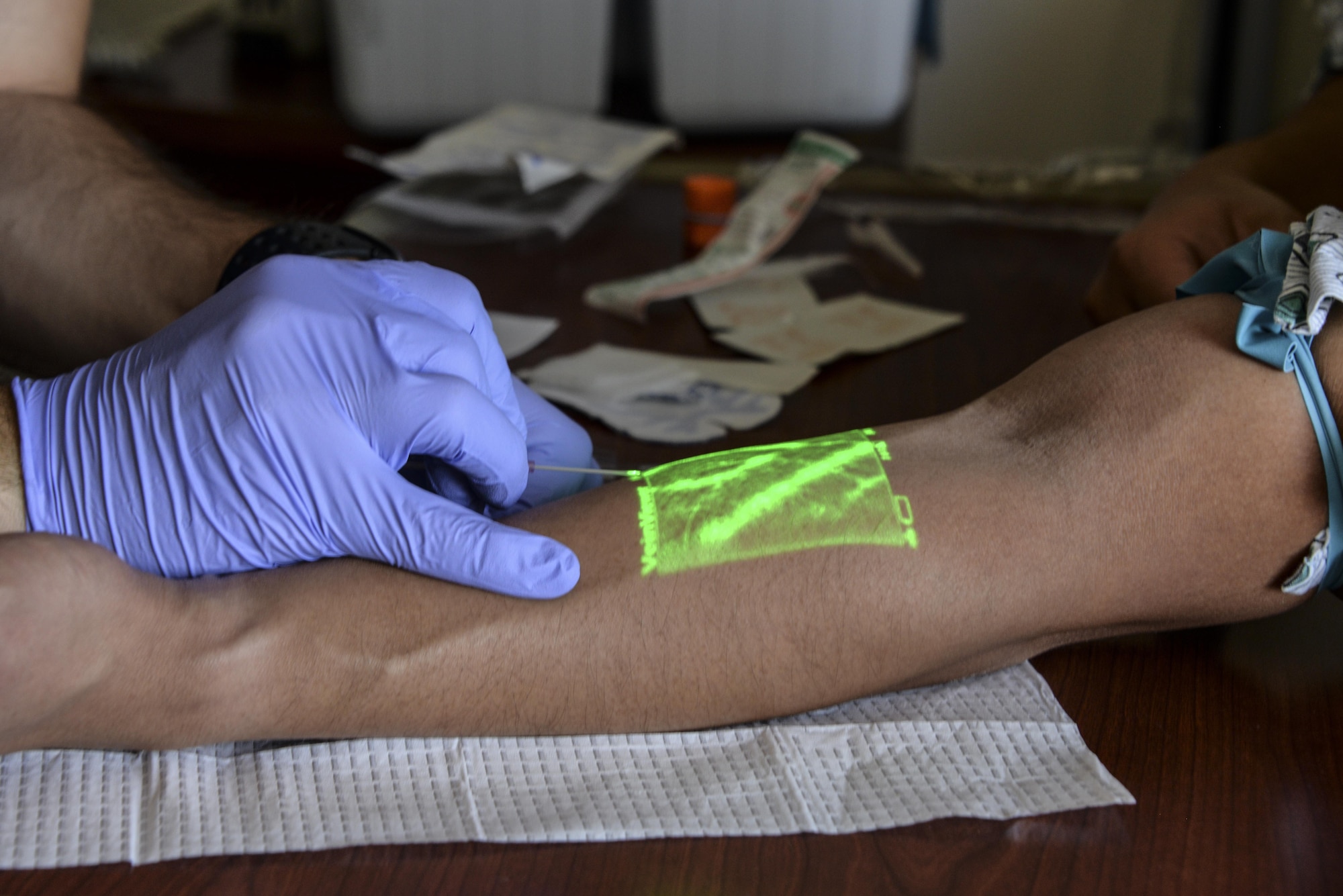 A vein mapper assists medical technicians in finding veins for intravenous medical care by scanning and highlighting veins Aug. 23 at Travis Air Force Base, California.