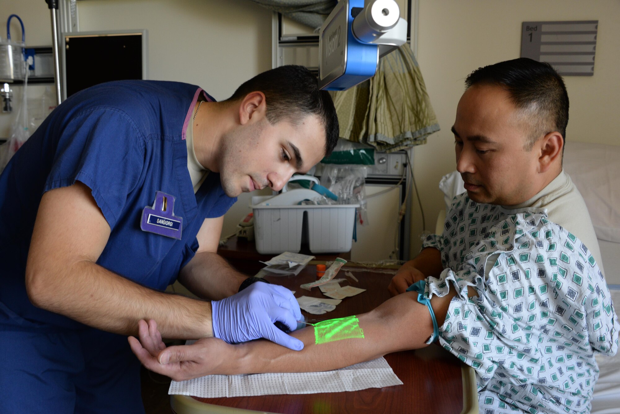 Second Lt. Jared Sangiorgi, 60th IPTS clinical nurse, starts an IV using a vein mapper Aug. 23 at Travis Air Force Base, California. 