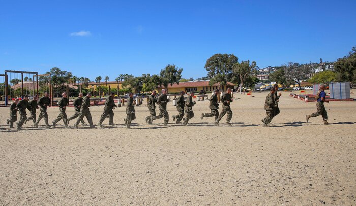 Recruits from India Company, 3rd Recruit Training Battalion, follow their drill instructor to the next obstacle during Confidence Course I at Marine Corps Recruit Depot San Diego, Aug. 22. Drill instructors supervised the event and advised the recruits on the techniques needed to complete the different obstacles. Annually, more than 17,000 males recruited from the Western Recruiting Region are trained at MCRD San Diego. India Company is scheduled to graduate Oct. 28.
