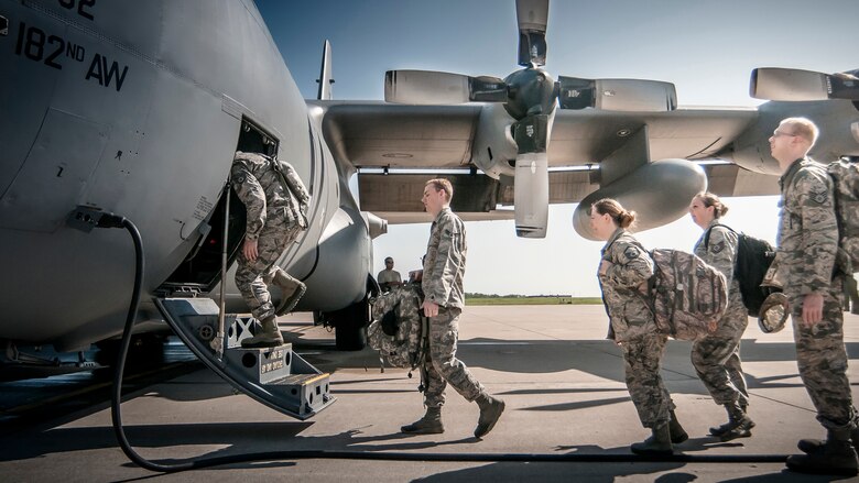 Airman from the 168th Air Support Operations Squadron, Peoria, Ill., load into a C-130 Hercules from the 182nd Airlift Wing, Peoria, Ill., on July 17, 2015, at the 182nd Airlift Wing, Peoria, Ill., to be transported to Alpena Combat Readiness Traning Center, Alpena, Michigan to participate in Exercise Northern Strike 2015. Exercise Northern Strike 2015 is a joint multi-national combined arms training exercise conducted in Michigan. (U.S. Air National Guard photo by Master Sgt. Scott Thompson/released)