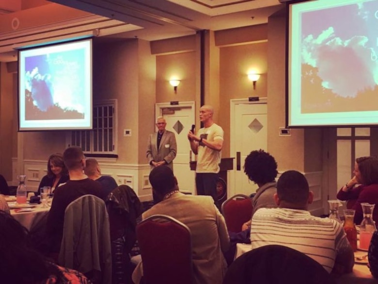 Staff Sgt. Tim Hucal stands with Lt.Gen. Jeff Oster, USMC (Ret.) as they speak to the question, “Is there more to life than this?” at the Spring 2016 Alpha on Quantico welcome dinner.