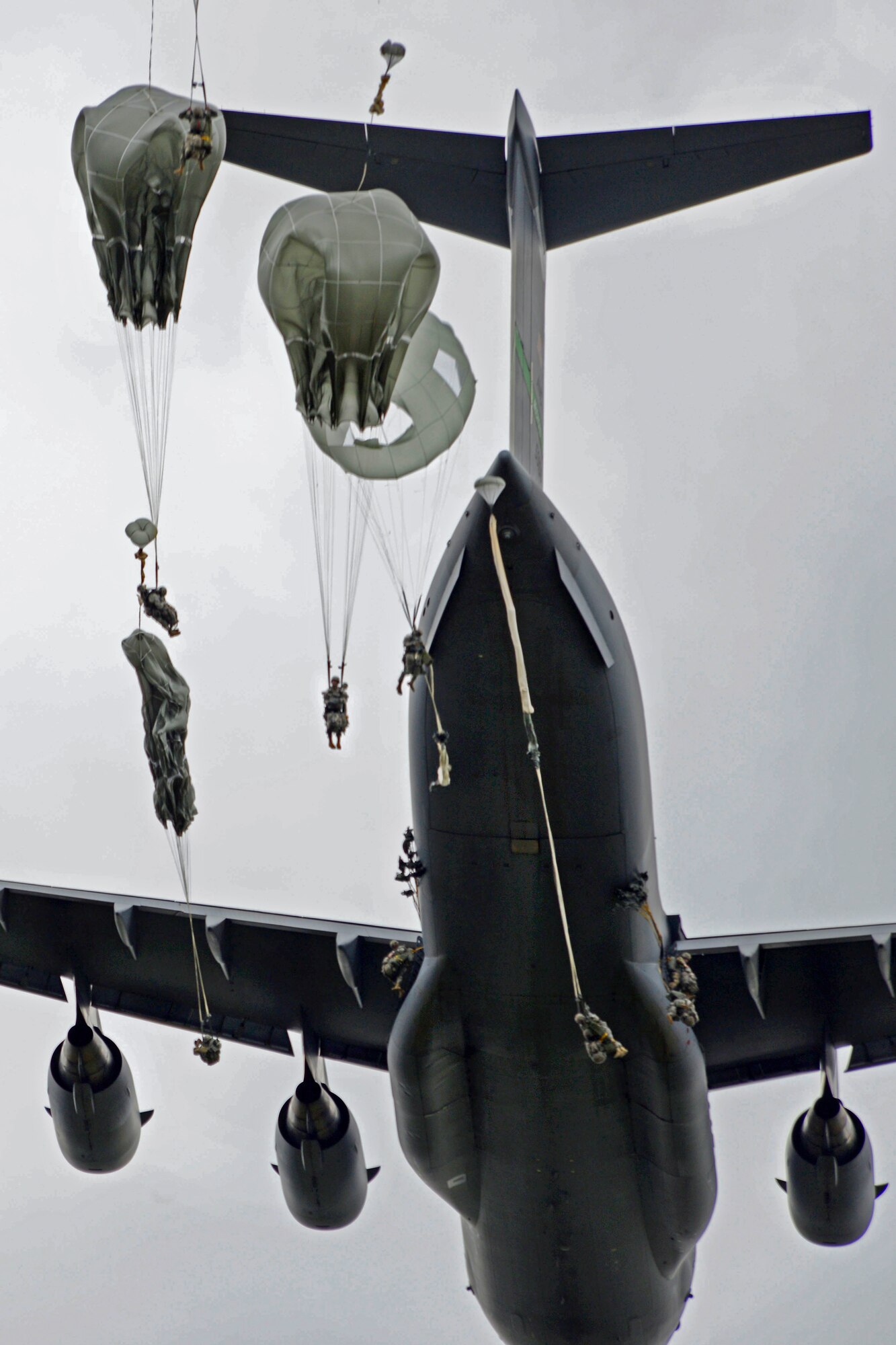 Paratroopers assigned to the 4th Infantry Brigade Combat Team (Airborne), 25th Infantry Division, U.S. Army Alaska, jump from a C-17 Globemaster III during a joint forcible entry exercise at Malemute Drop Zone on Joint Base Elmendorf-Richardson, Alaska, Aug. 23, 2016, as part of Exercise Spartan Agoge. Spartan Agoge is a brigade-level field training exercise that began Aug. 15, and focuses on an array of combat-related tasks from squad live-fire exercises to helicopter air insertion and airborne assault training. (U.S. Air Force photo by Airman 1st Class Valerie Monroy)