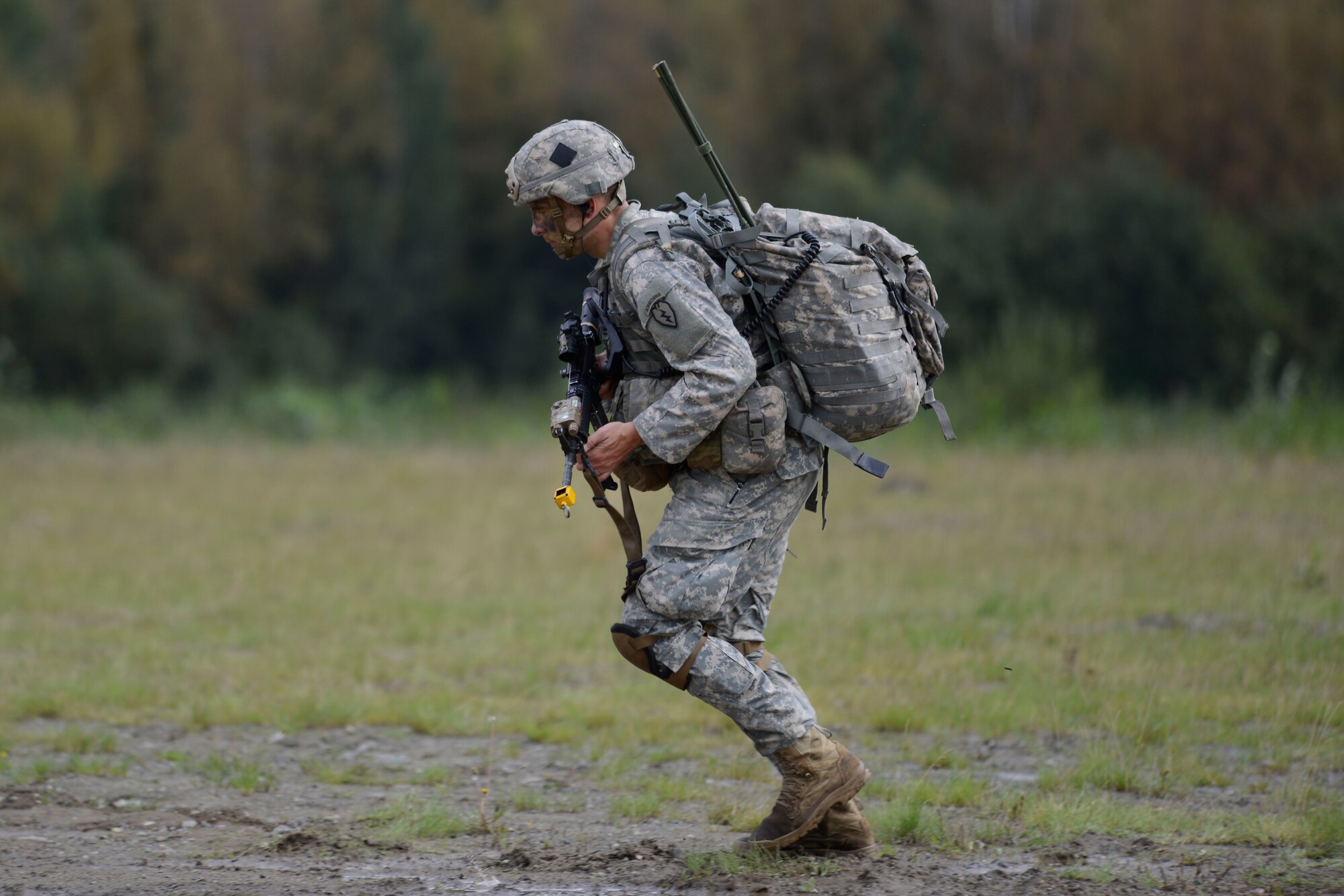 A paratrooper assigned to the1st Battalion, 501st Parachute Infantry Regiment,4th Infantry Brigade Combat Team (Airborne), 25th Infantry Division, U.S. Army Alaska, participates in a joint forcible entry exercise at Malemute Drop Zone on Joint Base Elmendorf-Richardson, Alaska, Aug. 23, 2016, as part of Exercise Spartan Agoge. Spartan Agoge is a brigade-level field training exercise that began Aug. 15, and focuses on an array of combat-related tasks from squad live-fire exercises to helicopter air insertion and airborne assault training. (U.S. Air Force photo by Airman 1st Class Valerie Monroy)
