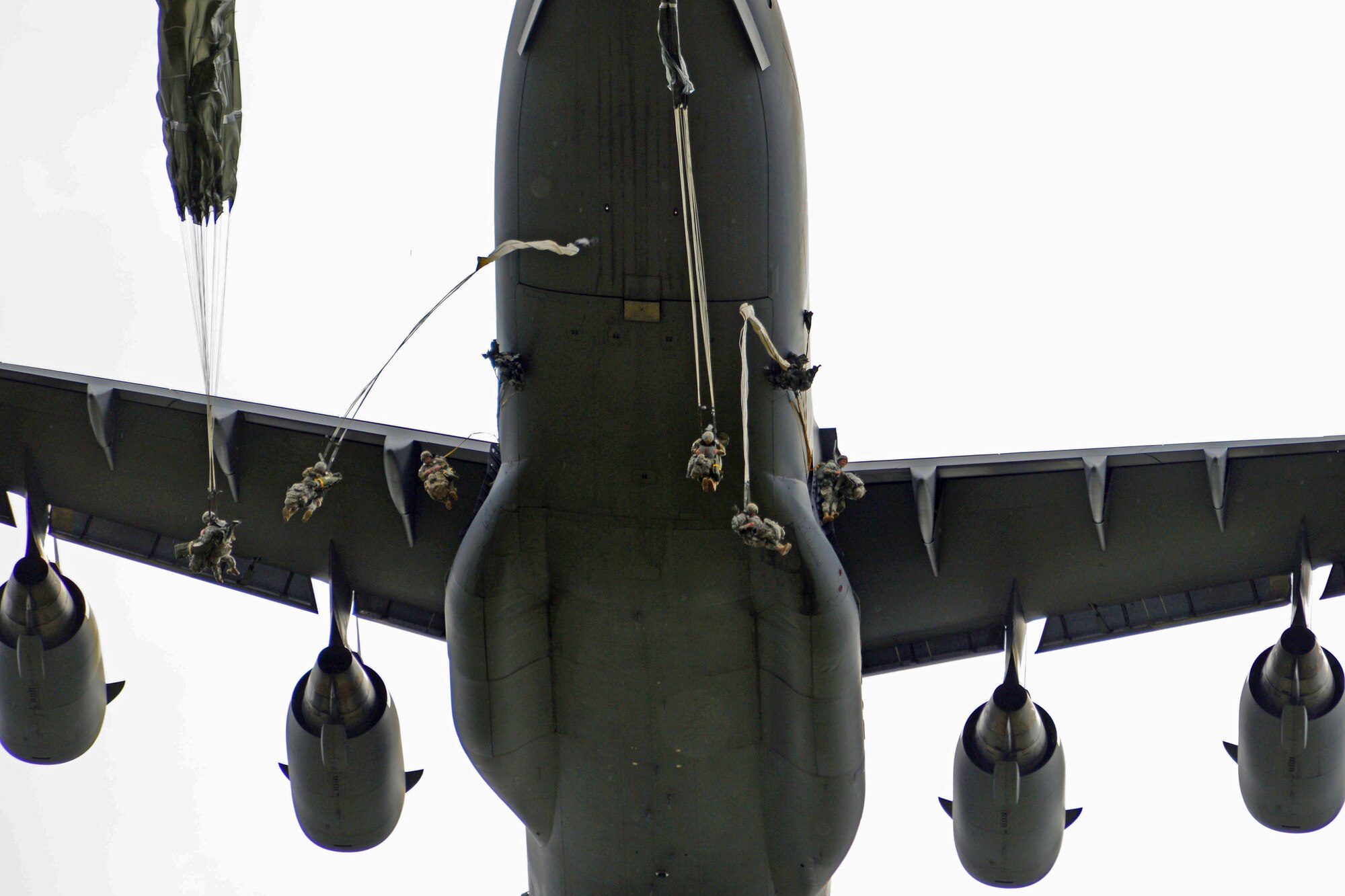 Paratroopers assigned to the 4th Infantry Brigade Combat Team (Airborne), 25th Infantry Division, U.S. Army Alaska, jump from a C-17 Globemaster III during a joint forcible entry exercise at Malemute Drop Zone on Joint Base Elmendorf-Richardson, Alaska, Aug. 23, 2016, as part of Exercise Spartan Agoge. Spartan Agoge is a brigade-level field training exercise that began Aug. 15, and focuses on an array of combat-related tasks from squad live-fire exercises to helicopter air insertion and airborne assault training. (U.S. Air Force photo by Airman 1st Class Valerie Monroy)