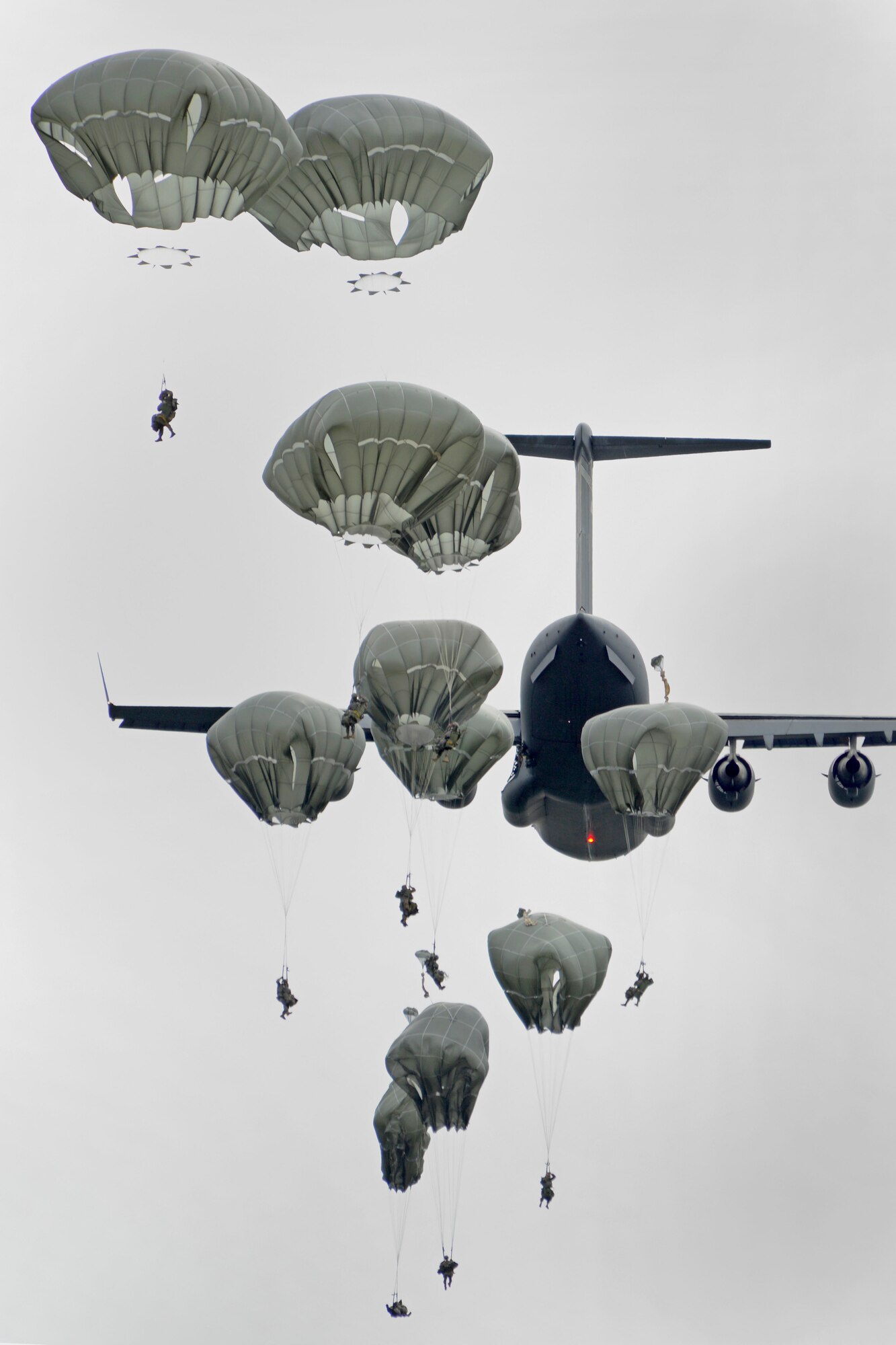 Paratroopers assigned to the 4th Infantry Brigade Combat Team (Airborne), 25th Infantry Division, U.S. Army Alaska, jump from a C-17 Globemaster III during a joint forcible entry exercise at Malemute Drop Zone on Joint Base Elmendorf-Richardson, Alaska, Aug. 23, 2016, as part of Exercise Spartan Agoge. Spartan Agoge is a brigade-level field training exercise that began Aug. 15, and focuses on an array of combat-related tasks from squad live-fire exercises to helicopter air insertion and airborne assault training. (U.S. Air Force photo by Airman 1st Class Valerie Monroy)