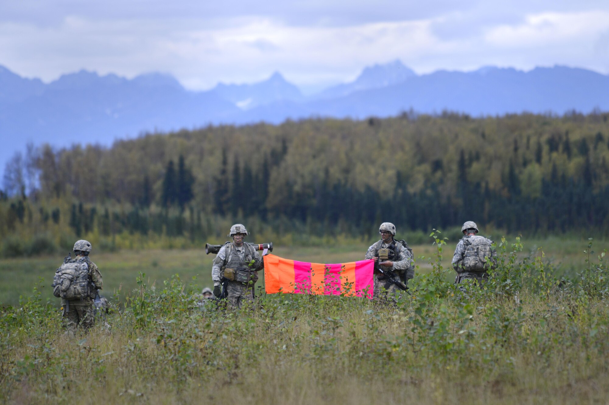 Paratroopers assigned to the 1st Battalion, 501st Parachute Infantry Regiment, 4th Infantry Brigade Combat Team (Airborne), 25th Infantry Division, U.S. Army Alaska, participate in a joint forcible entry exercise at Malemute Drop Zone on Joint Base Elmendorf-Richardson, Alaska, Aug. 23, 2016, as part of Exercise Spartan Agoge. Spartan Agoge is a brigade-level field training exercise that began Aug. 15, and focuses on an array of combat-related tasks from squad live-fire exercises to helicopter air insertion and airborne assault training. (U.S. Air Force photo by Airman 1st Class Valerie Monroy)